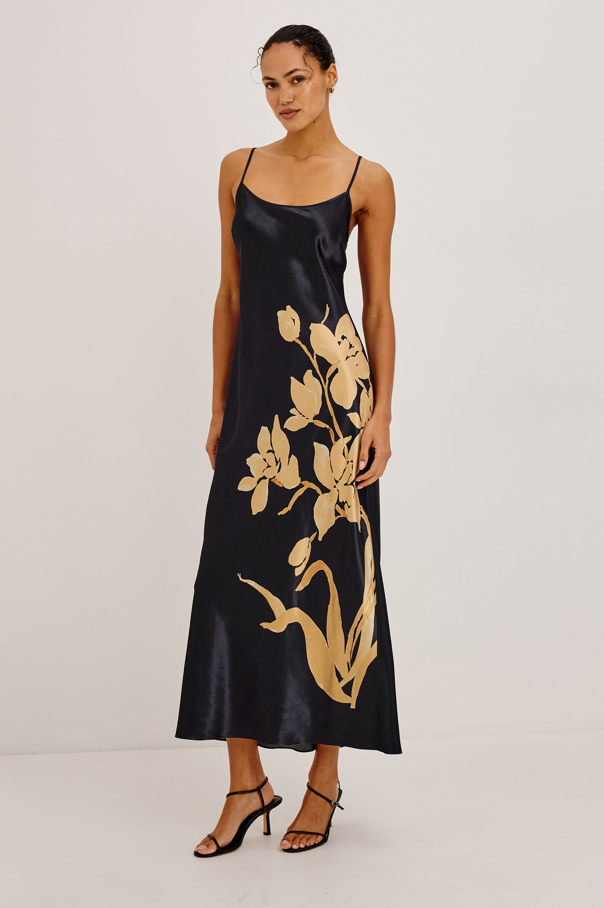 Jaya Midi Dress in Satin-Back Crepe With Scoop Neckline and Adjustabel Spaghetti Straps in Gold Lily Colorway - Full Body Front View Featured on Model.