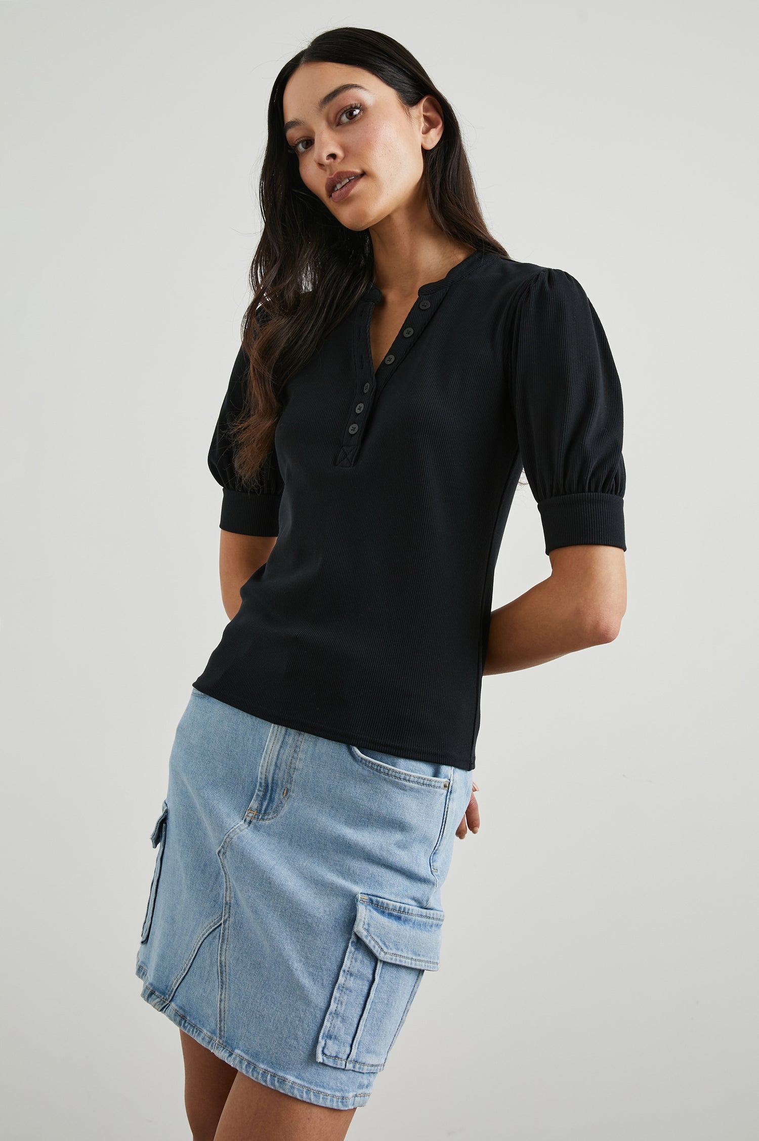 Jewel Top with Elbow-Length Sleeves, a Six Button Placket Creating a V Neck, Elasticized Cuffs and Light Ruching on Sleeves in Black Colorway - Front View Featured on Model