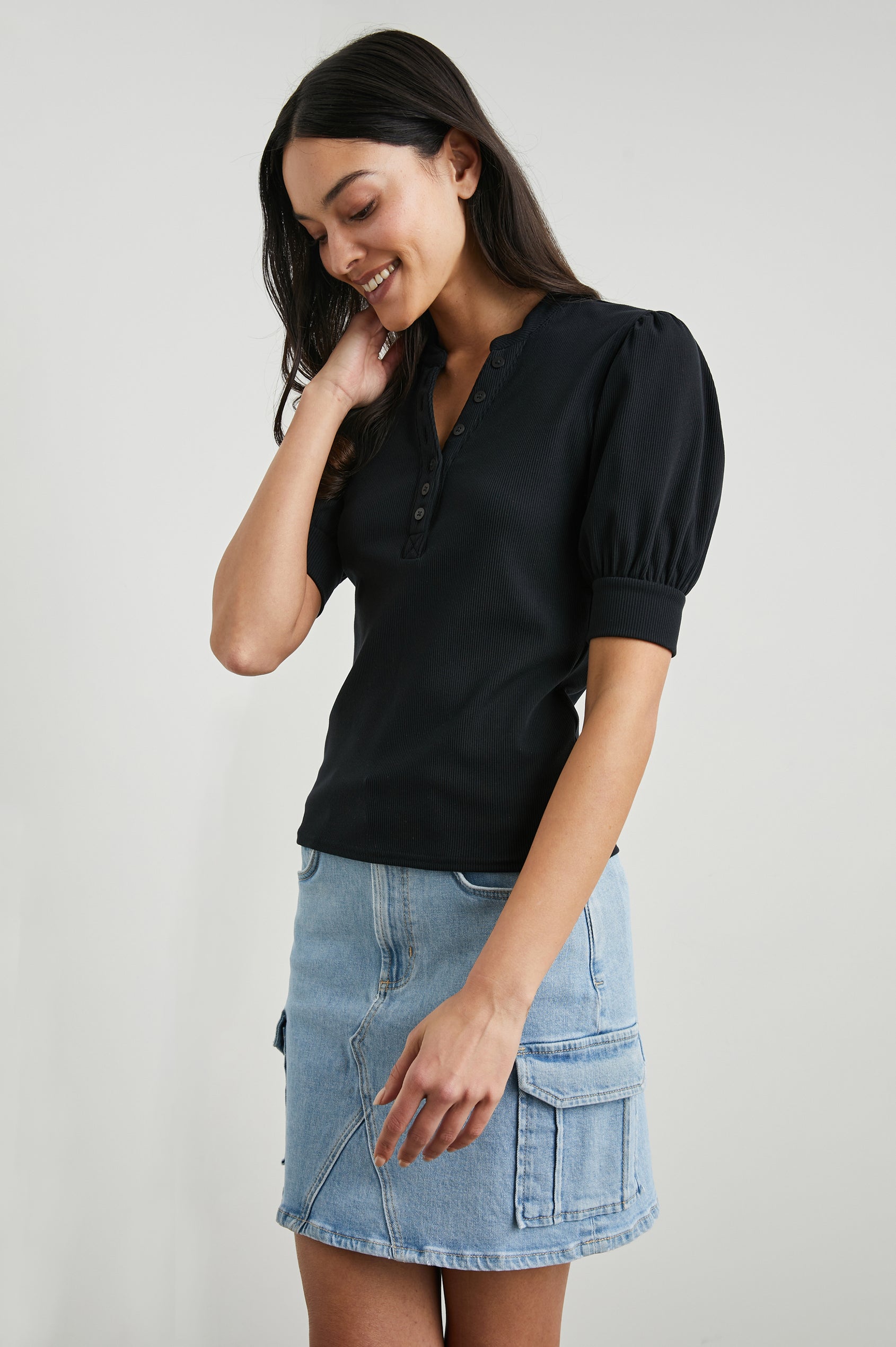 Jewel Top with Elbow-Length Sleeves, a Six Button Placket Creating a V Neck, Elasticized Cuffs and Light Ruching on Sleeves in Black Colorway - Front View Featured on Model