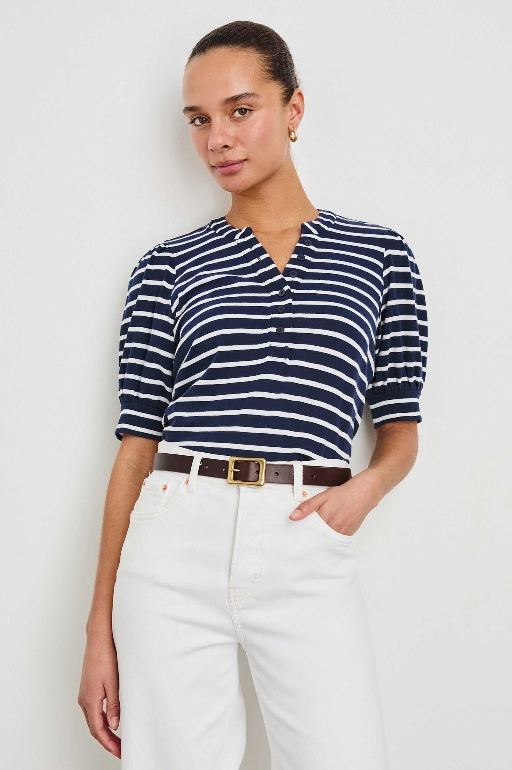 Jewel Puff Short Sleeve With Quarter Down Buttons In Colorway Navy Ivory Stripe - front view on model, tucked in with belt
