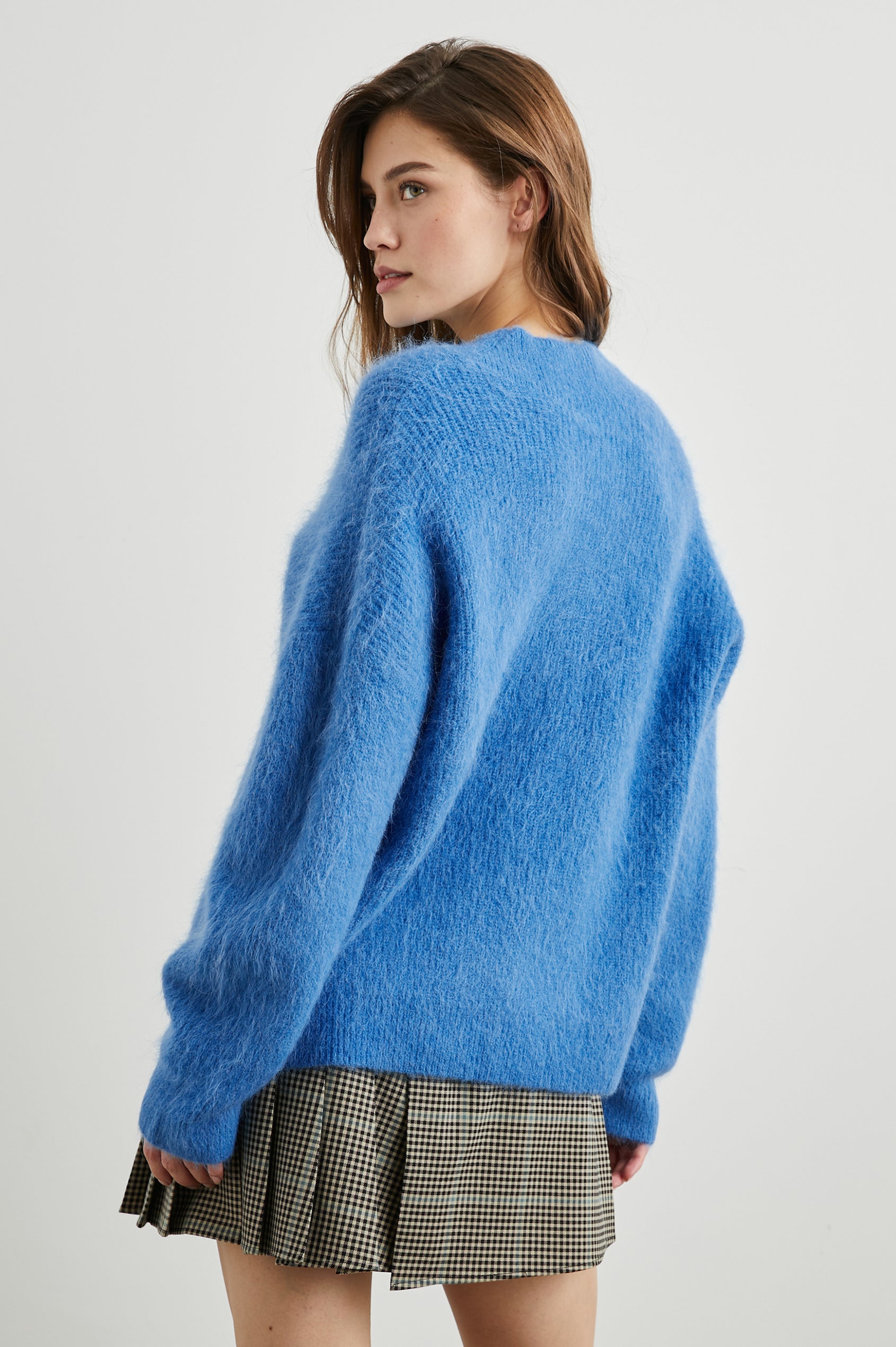 Jodie Long-Sleeve Sweater with a V Neck in Cobalt Colorway  - Back View Featured on Model