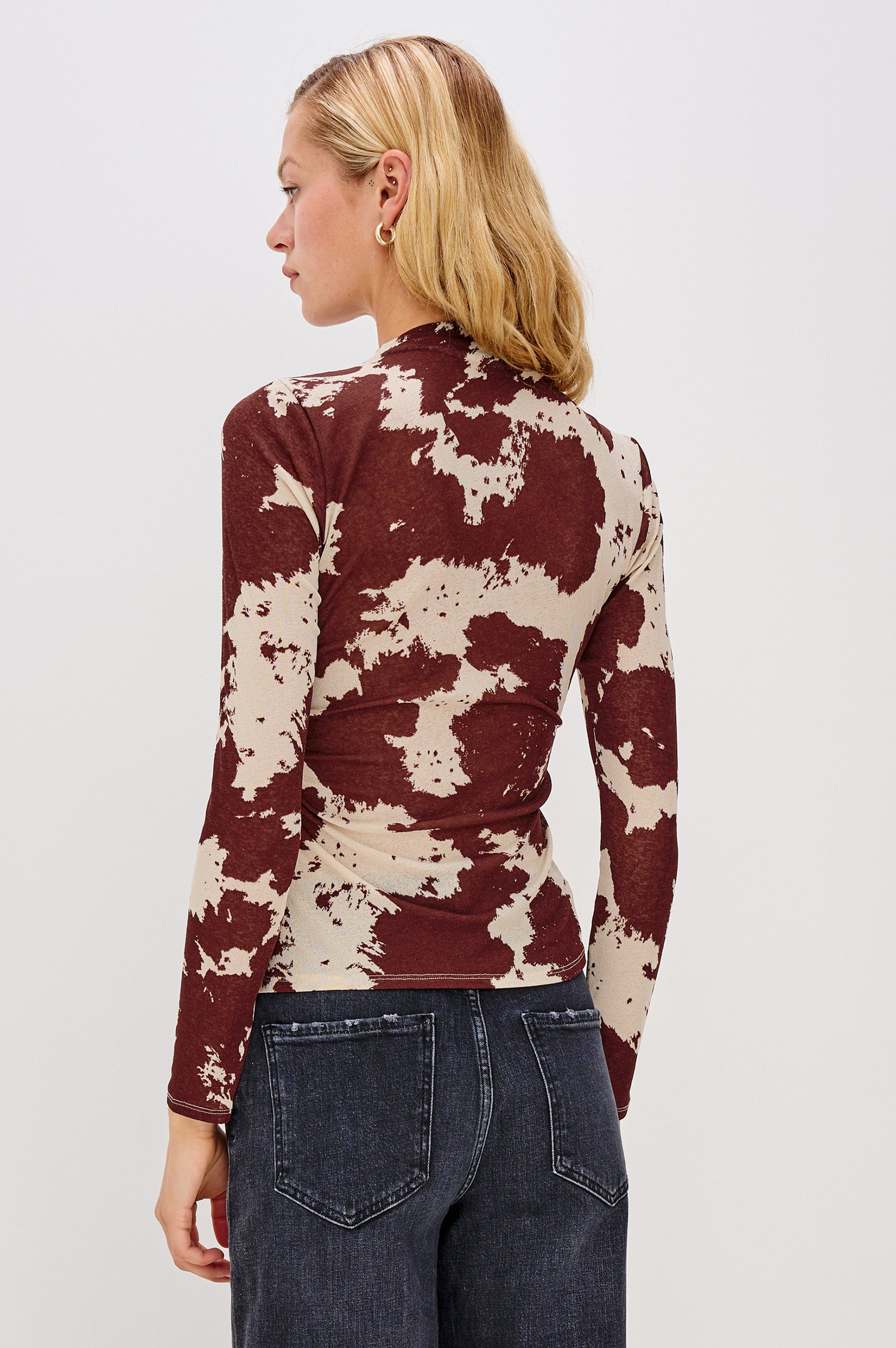 Joelle Long Sleeve Top with An Asymmetrical Mock Neck and Shirring on the Right Shoulder in Cowgirl Colorway - Back View Featured on Model