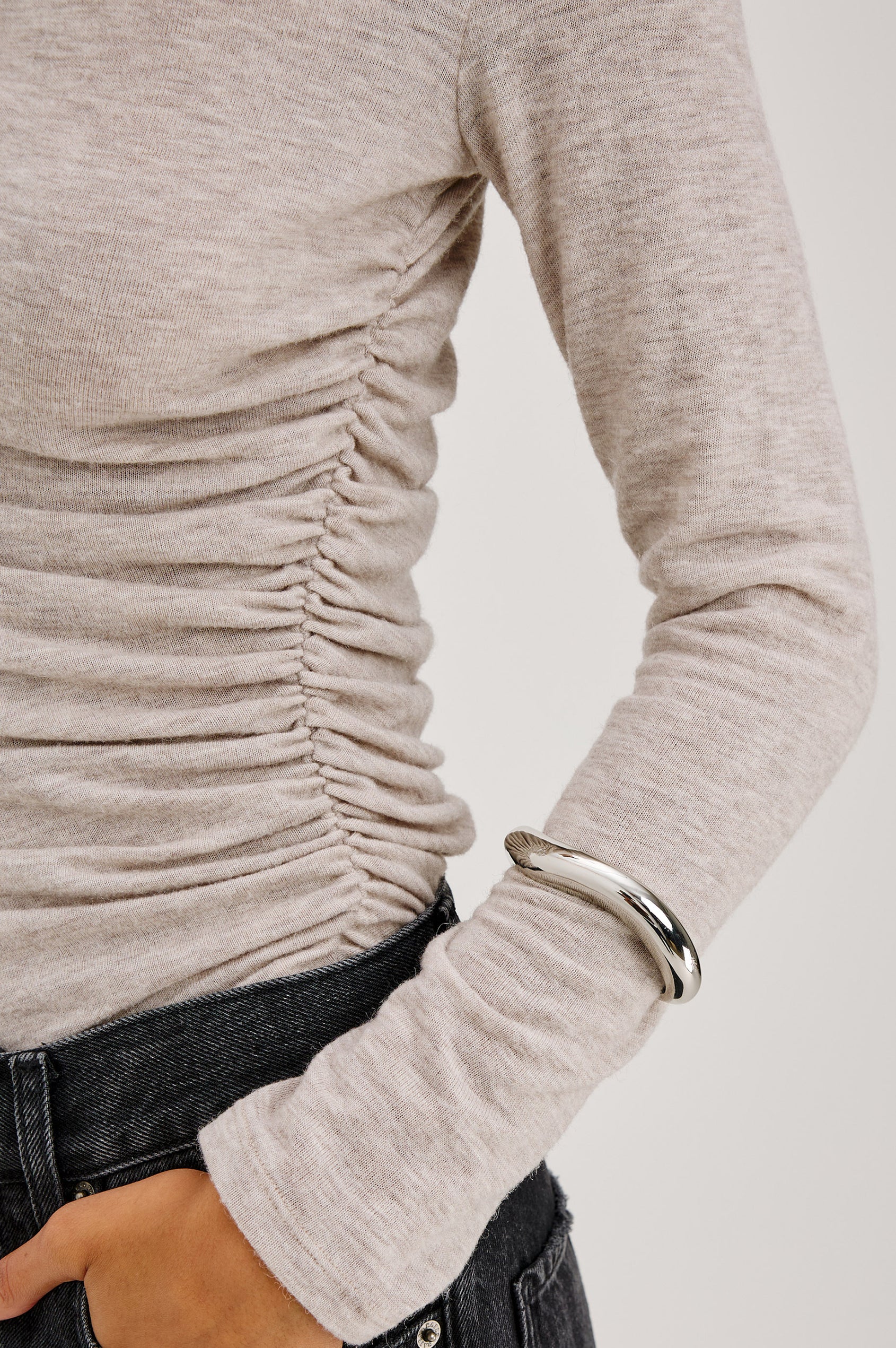 Joelle Top Fitted in Jersey With High Funnel Neckl, Long Sleeves, and Asymmetric Shoulder Shirring in Heather Oatmeal Colorway - Mid Body Front Close Up View Featured on Model