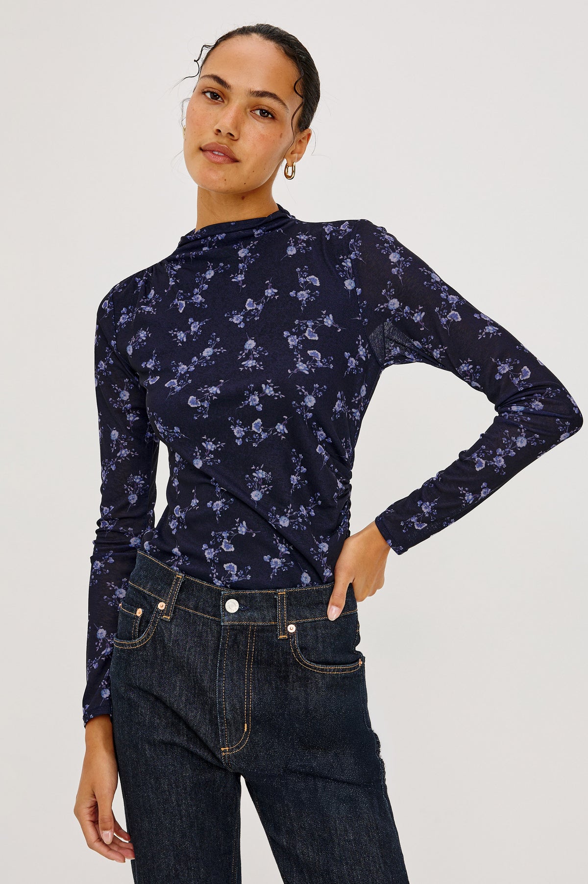 Joelle Top in Floral Print Mesh With Mock Neck Collar, Gathered Shoulders, and Long Sleeves in Navy Romantic Floral Colorway - Upper Body Front View Featured on Model.