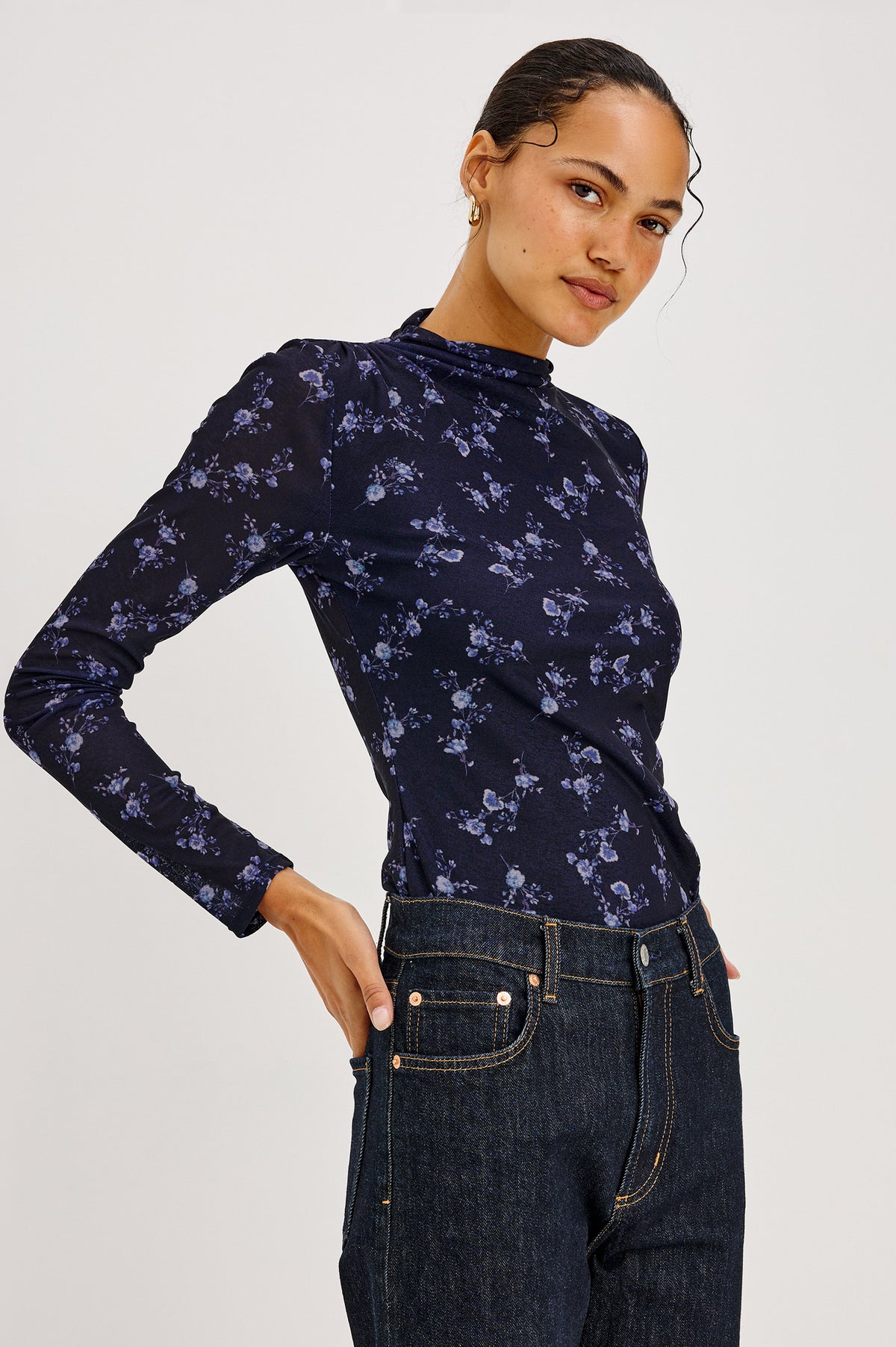 Joelle Top in Floral Print Mesh With Mock Neck Collar, Gathered Shoulders, and Long Sleeves in Navy Romantic Floral Colorway - Front View Featured on Model.