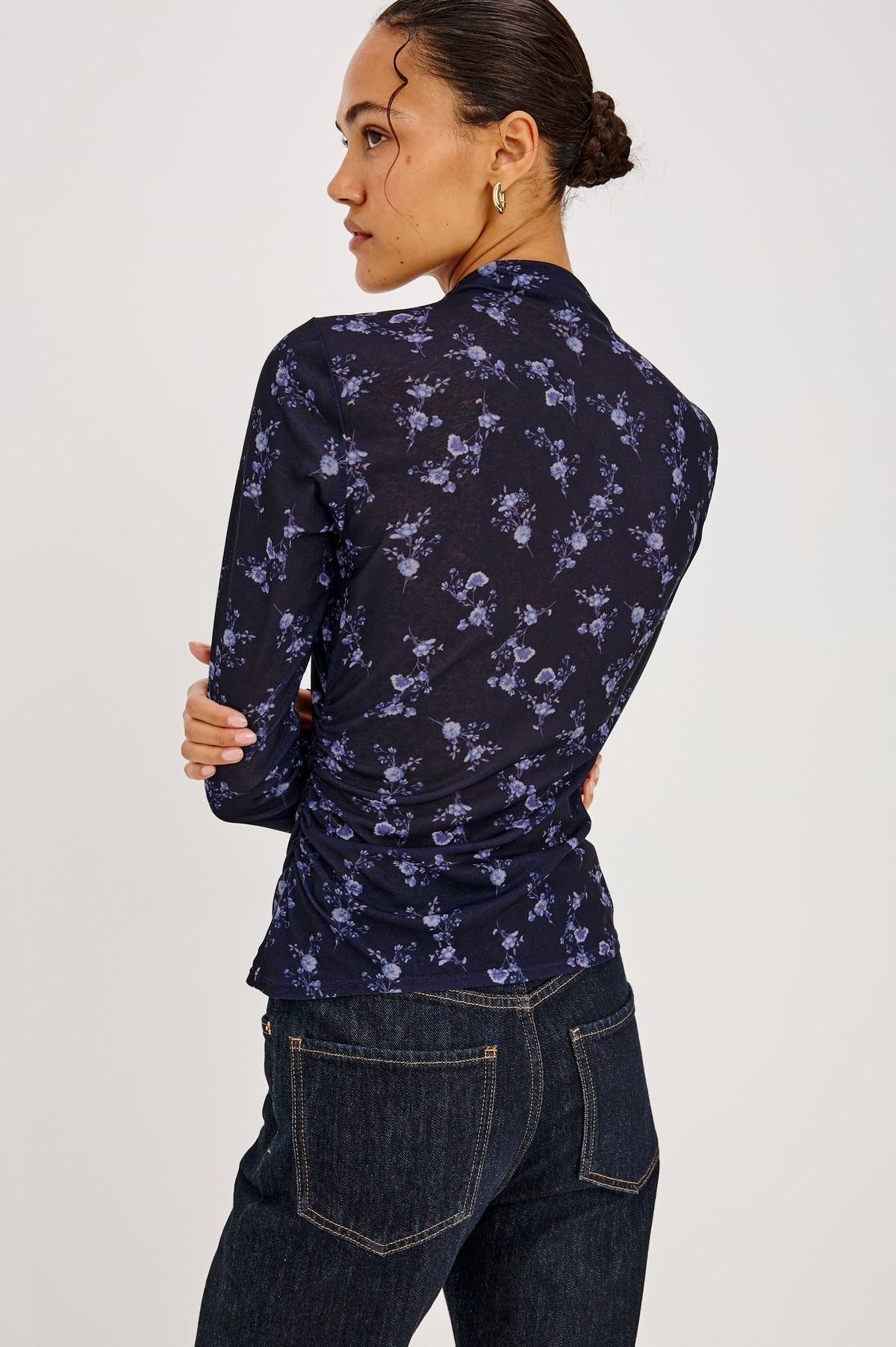 Joelle Top in Floral Print Mesh With Mock Neck Collar, Gathered Shoulders, and Long Sleeves in Navy Romantic Floral Colorway - Upper Body Back View Featured on Model.