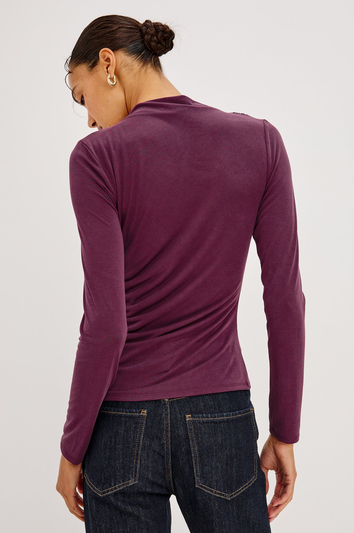 Joelle Top in Brushed Jersey With Draped Mock Neck, Shirring at Shoulder and Side, Long Sleeves, and Fitted Silhouette in Wine Colorway - Back Crop View Featured on Model.