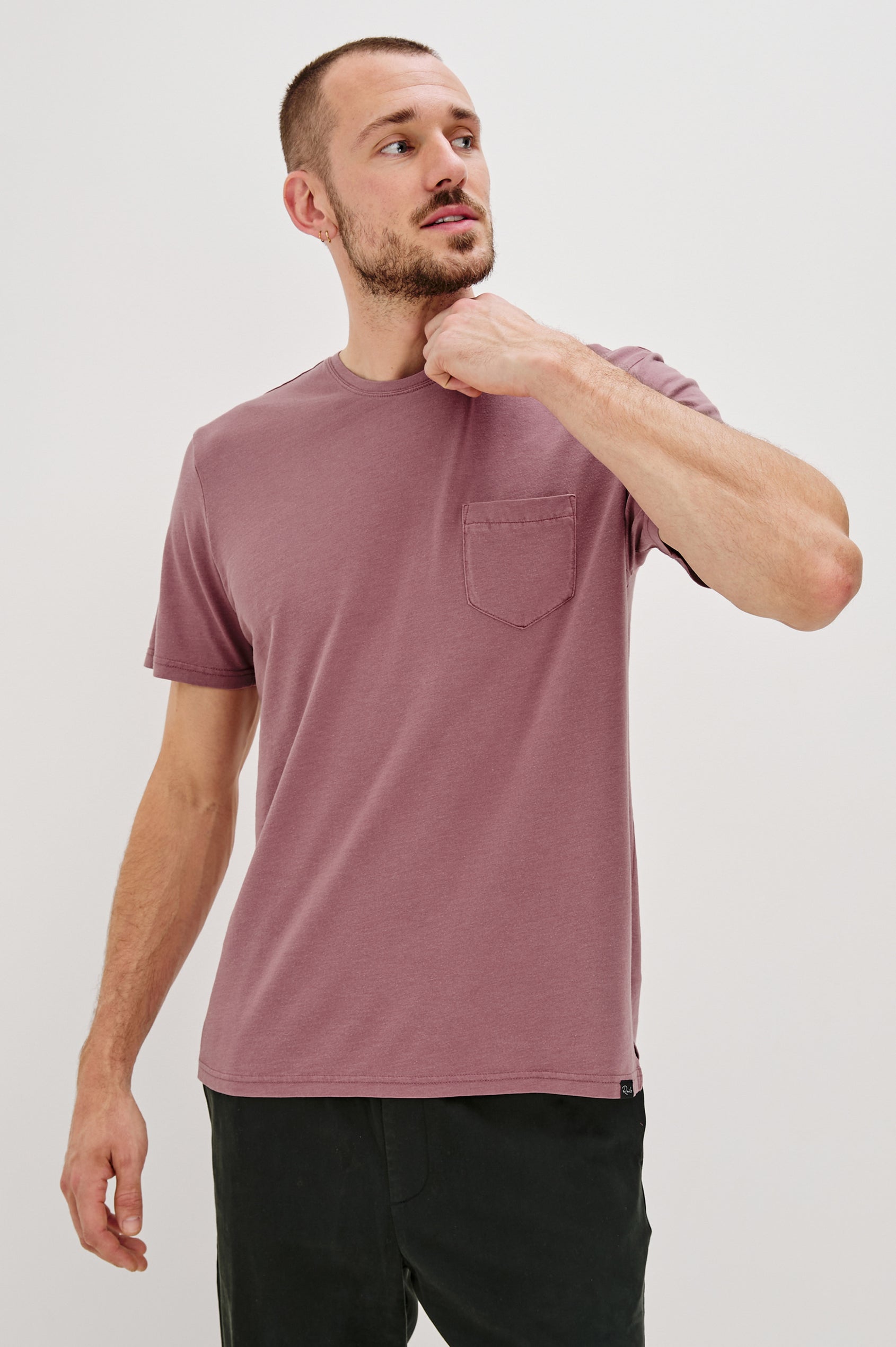 Johnny Short Sleeve T-Shirt with a Crew Neck, Chest Patch Pocket and Small Slits at the Side Hems in Cranberry Colorway - Front View Featured on Model