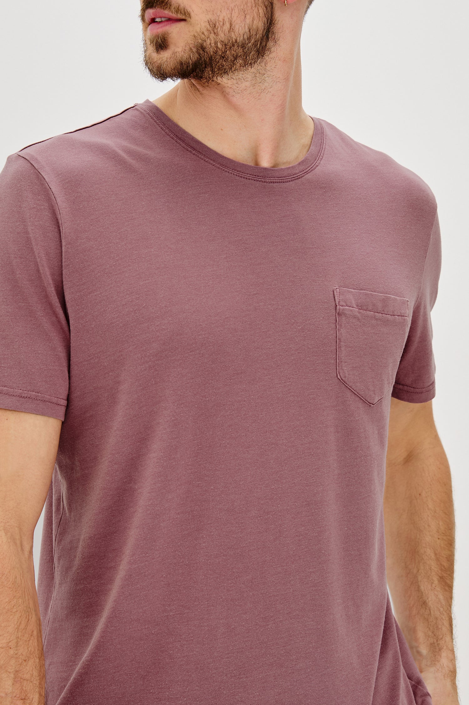 Johnny Short Sleeve T-Shirt with a Crew Neck, Chest Patch Pocket and Small Slits at the Side Hems in Cranberry Colorway - Front View Featured on Model