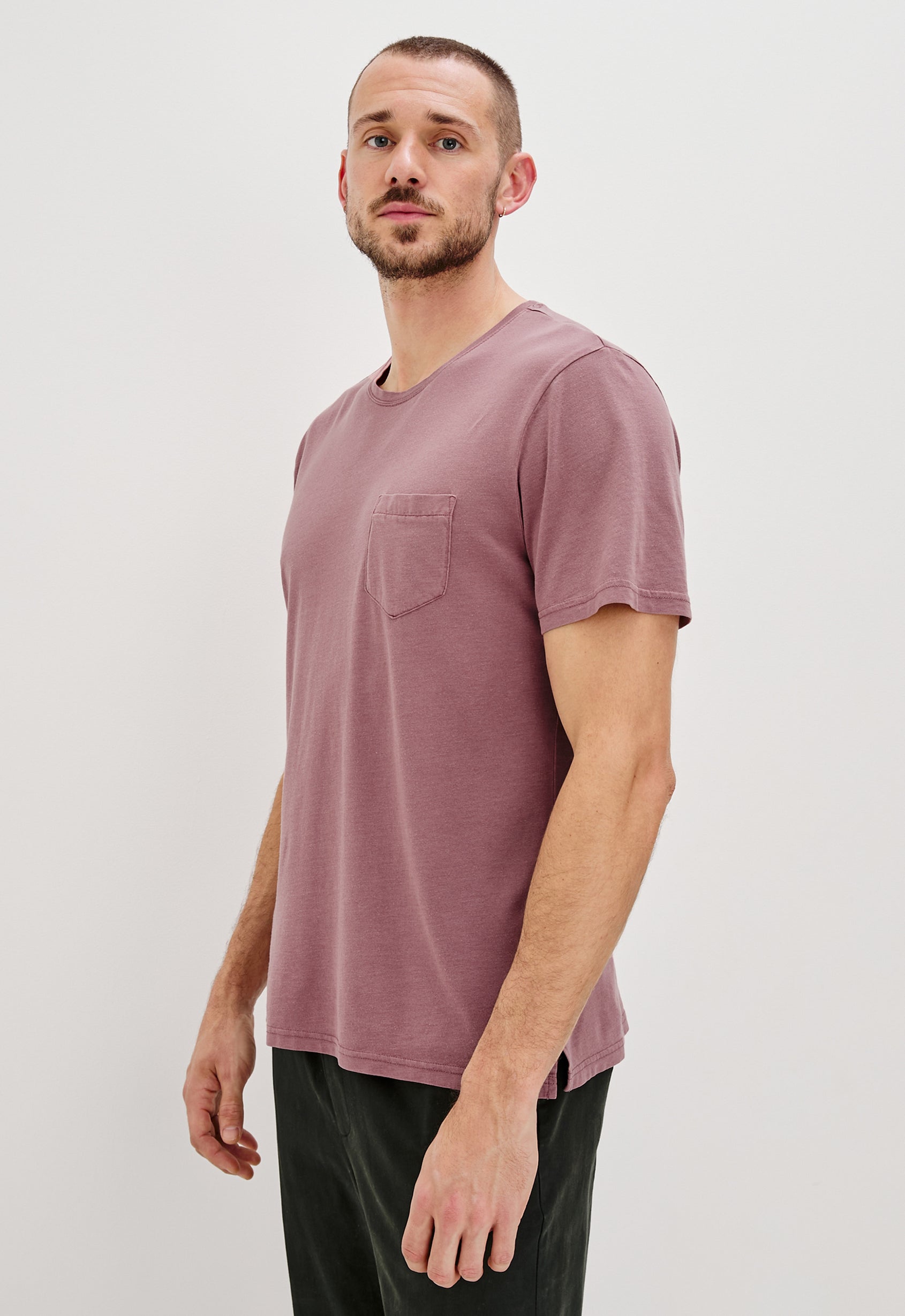 Johnny Short Sleeve T-Shirt with a Crew Neck, Chest Patch Pocket and Small Slits at the Side Hems in Cranberry Colorway - Side Front View Featured on Model