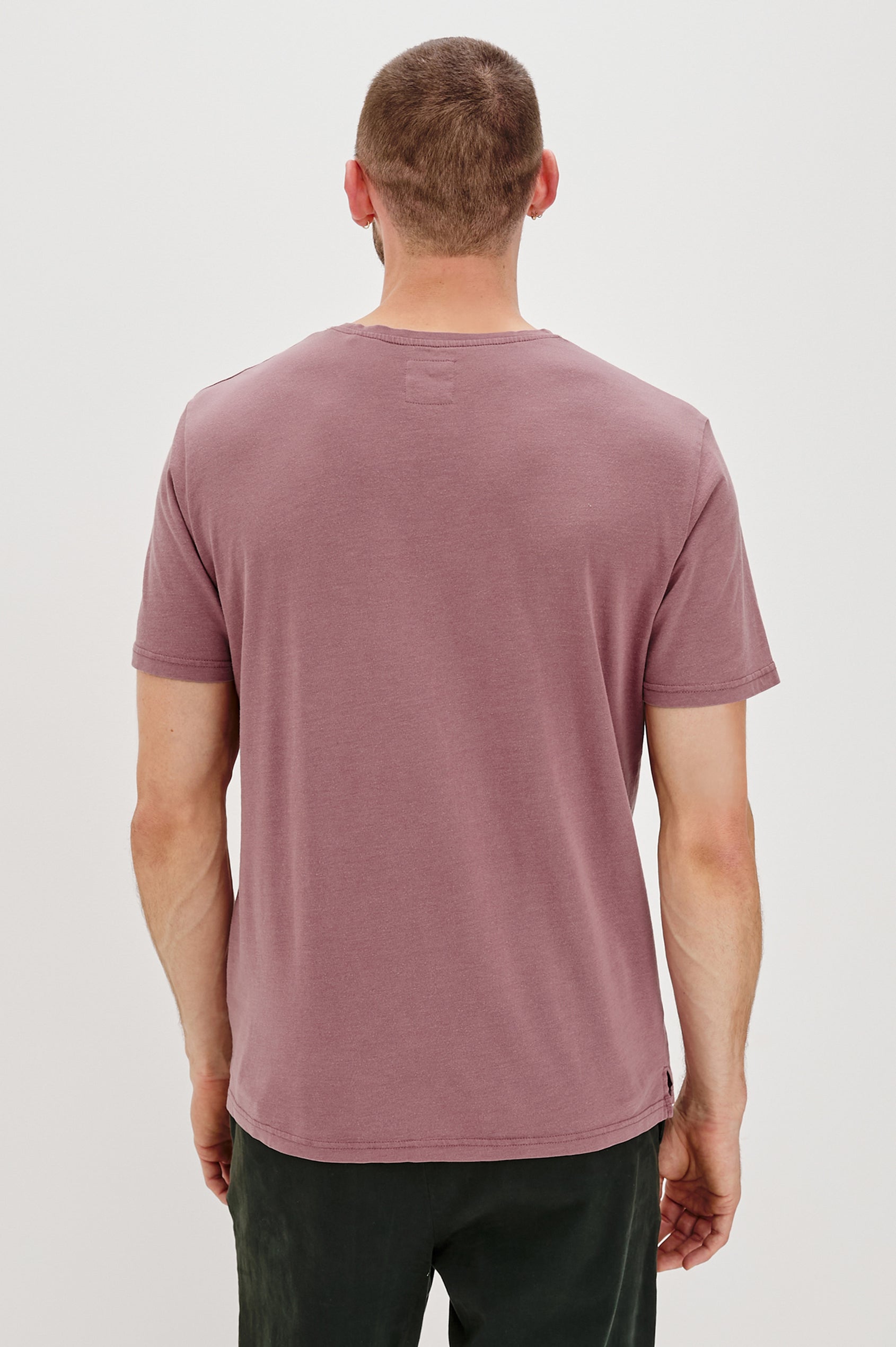 Johnny Short Sleeve T-Shirt with a Crew Neck, Chest Patch Pocket and Small Slits at the Side Hems in Cranberry Colorway - Back Body View Featured on Model