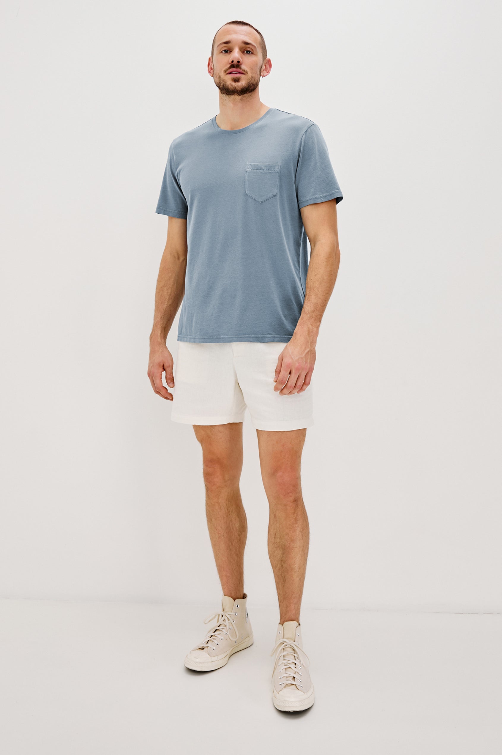 Johnny Short Sleeve T-Shirt with a Crew Neck, Chest Patch Pocket and Small Slits at the Side Hems in Steel Colorway - Full Body Front View Featured on Model