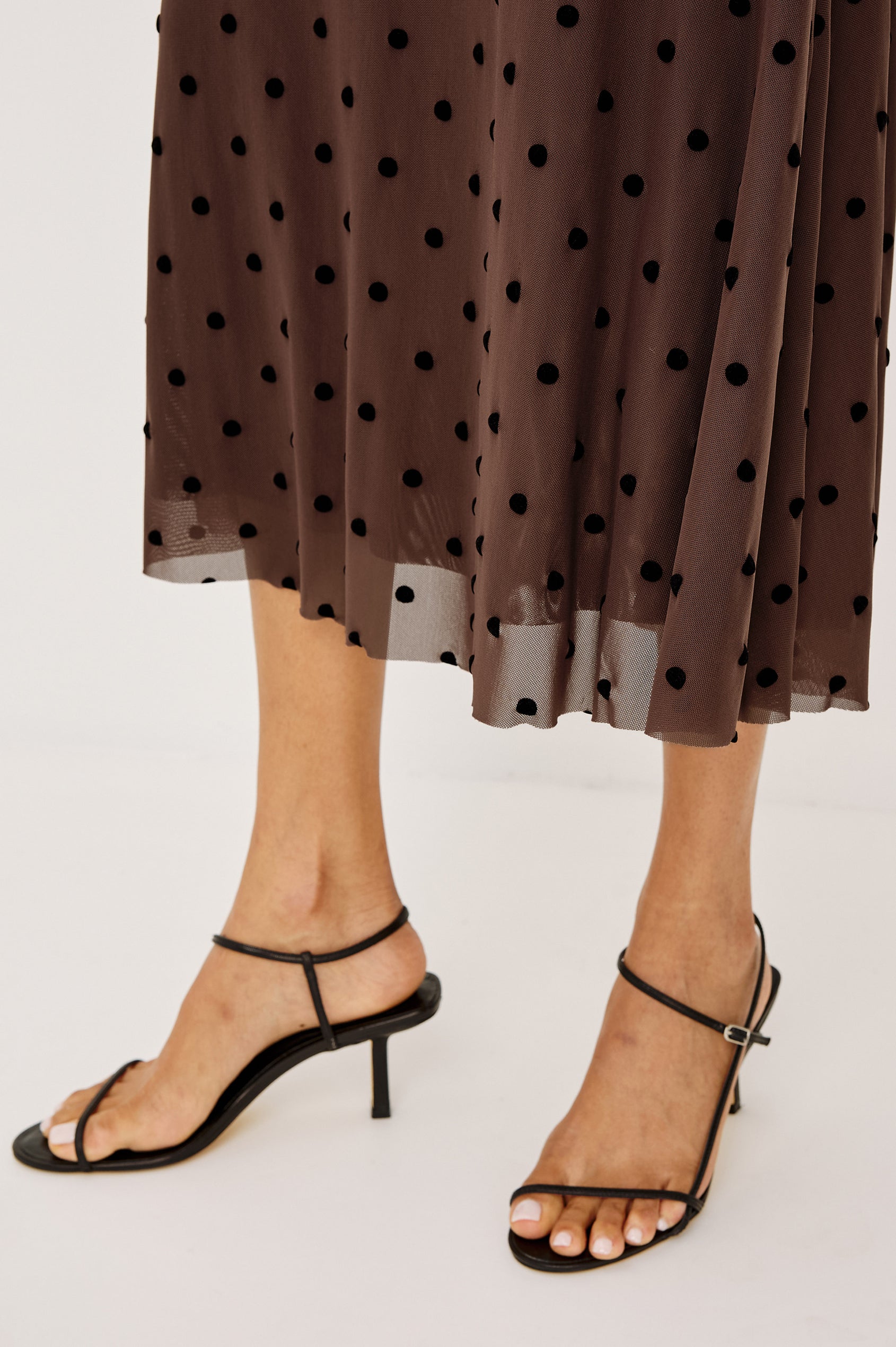 Jordan Midi Skirt in Stretch Mesh With Velvet Flocked Details, A-Line Fit, Full Lining, and Elastic Waistband in Chocolate Polka Dot Colorway - Lower Body Front View Featured on Model