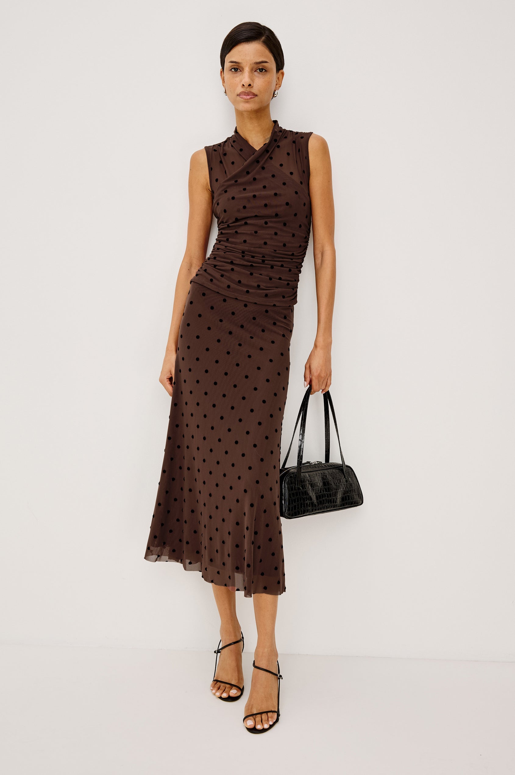 Jordan Midi Skirt in Stretch Mesh With Velvet Flocked Details, A-Line Fit, Full Lining, and Elastic Waistband in Chocolate Polka Dot Colorway - Full Body Front View Featured on Model