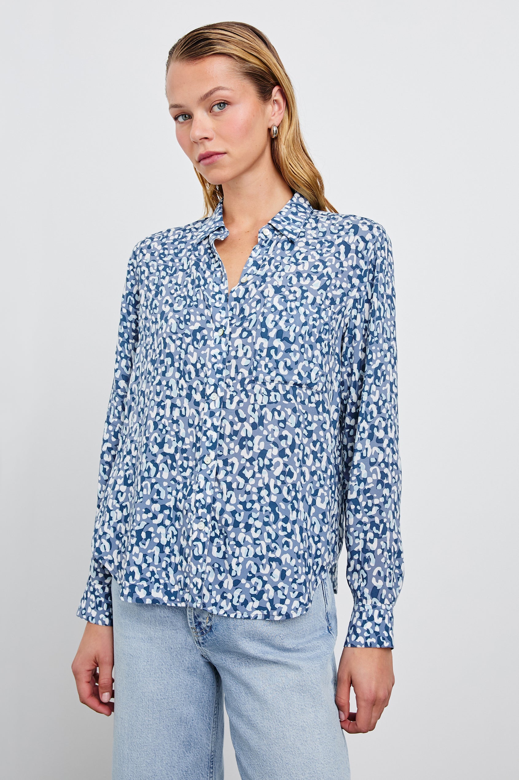 Josephine Long-Sleeve Button Down with a Chest Patch Pocket in Blue Mixed Cheetah Colorway, a cheetah pattern in blues and white - Front View Featured on Model