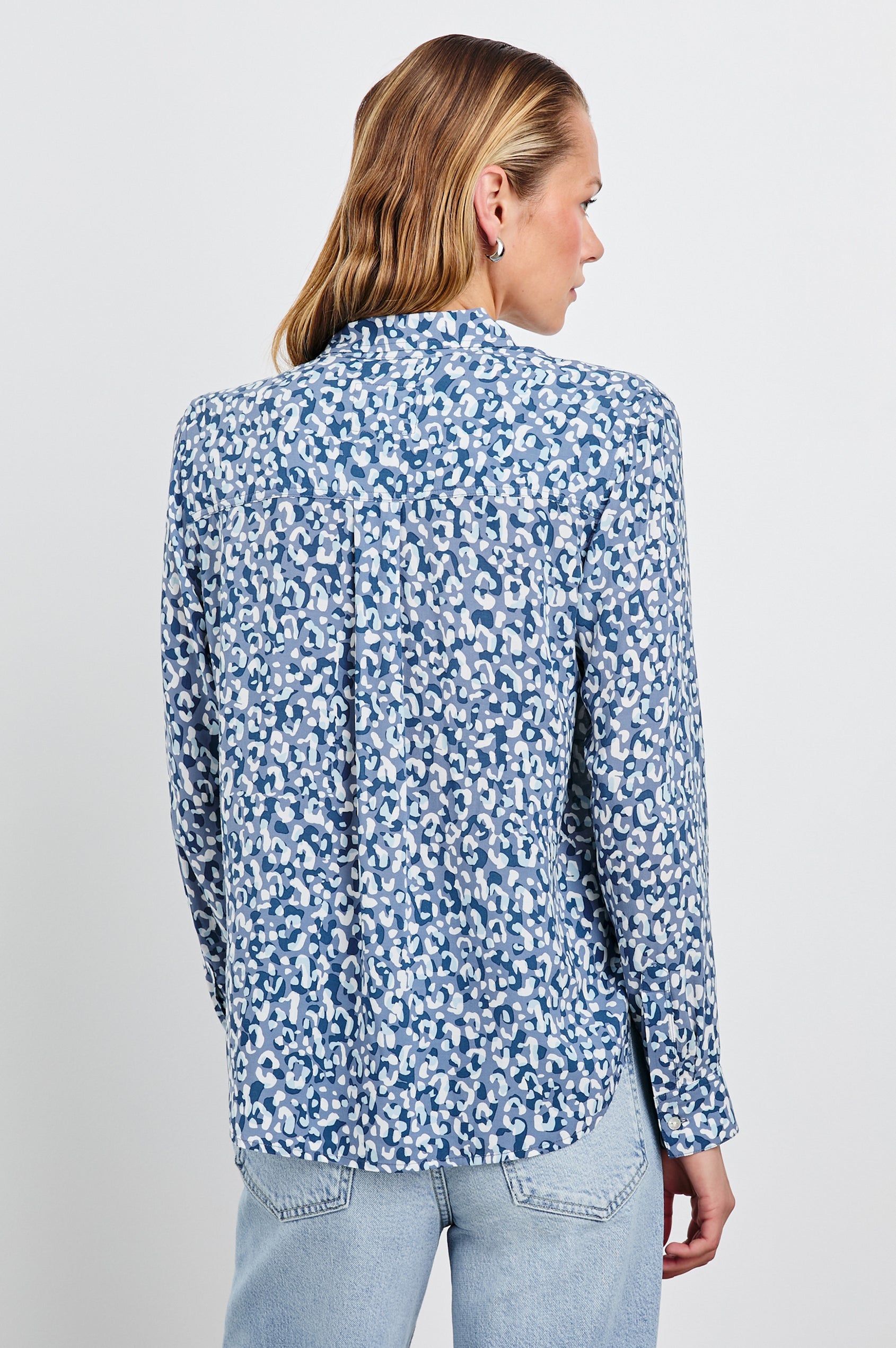 Josephine Long-Sleeve Button Down with a Chest Patch Pocket in Blue Mixed Cheetah Colorway, a cheetah pattern in blues and white - Back View Featured on Model