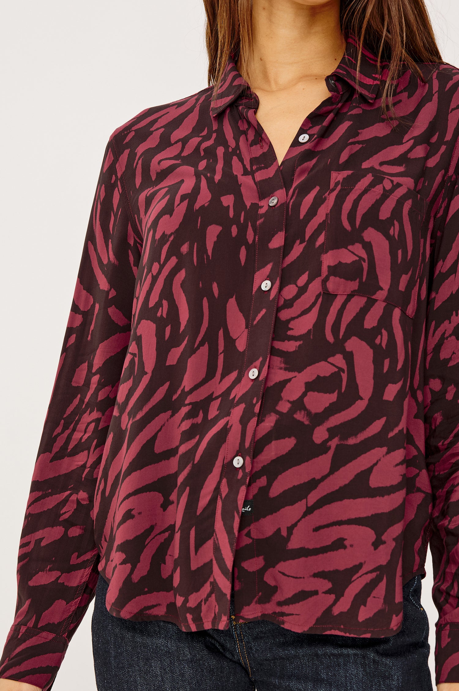 Josephine Button-Up Shirt in Rayon With Collar, Front Buttons, Chest Pockets, and Long Sleeves in Oxblood Tiger Stripe Colorway - Upper Body Close Up View Featured on Model
