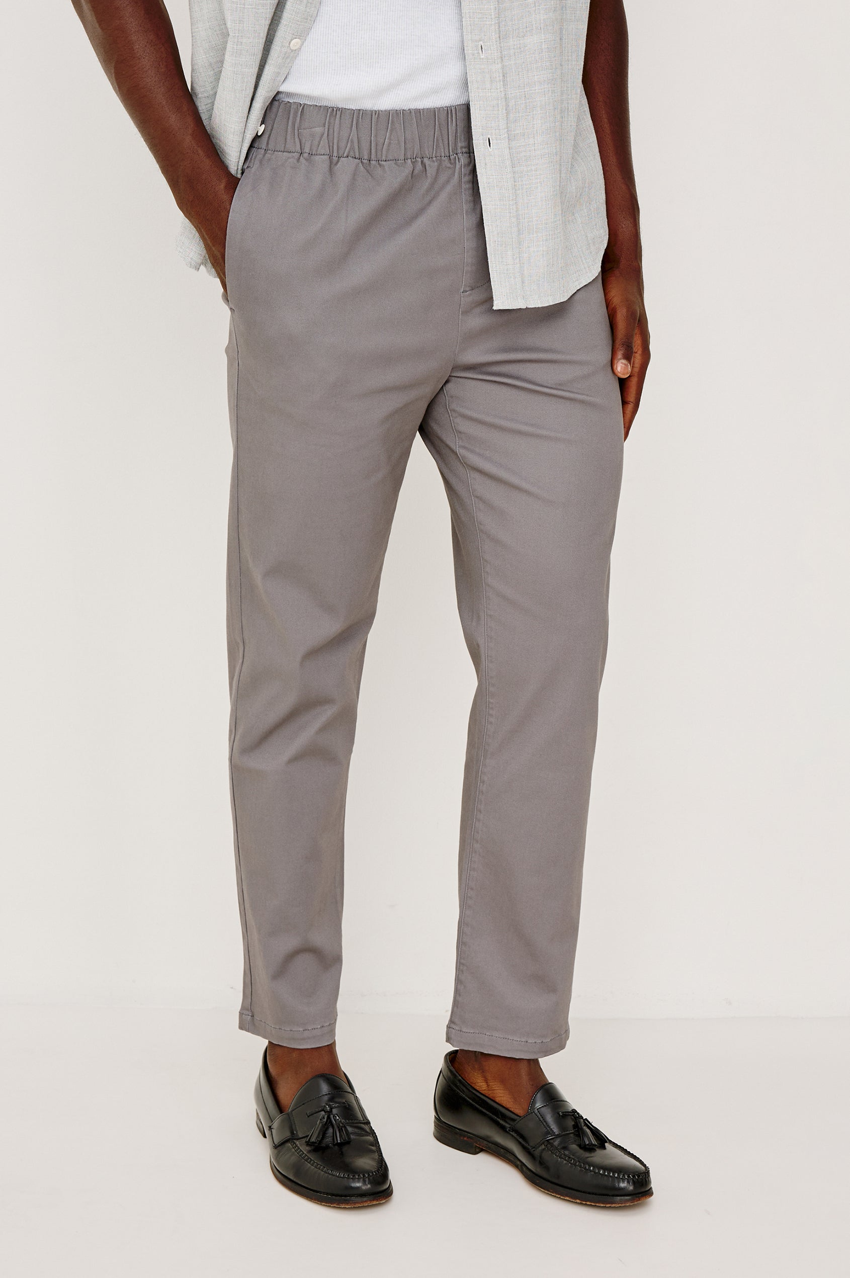 Julian Pants with an Elastic Waist, Two Front Pockets and Two Back Welt Pockets in Concrete Colorway - Front View Featured on Model