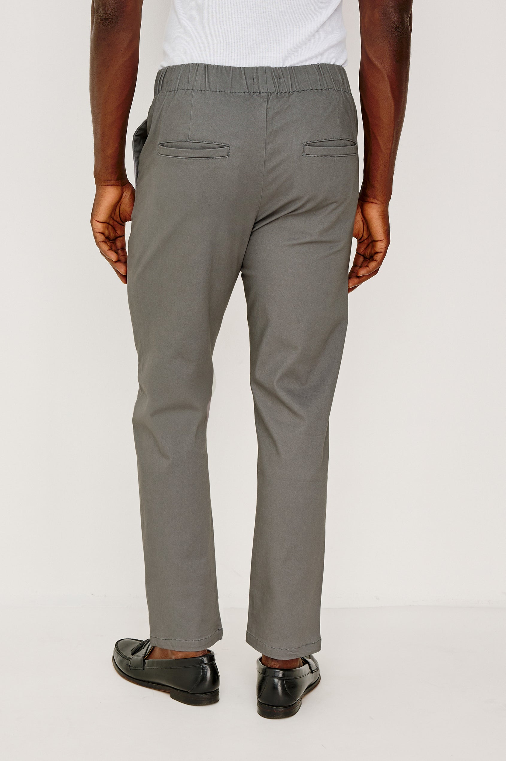 Julian Pant in Sueded Cotton Stretch with an Elastic Waist, Side Pockets, and Two Back Welt Pockets in Concrete Colorway - Lower Body Back View Featured on Model