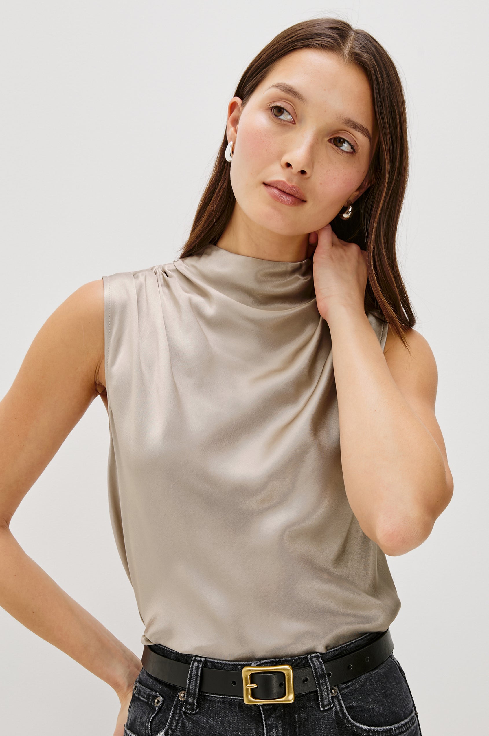 Kaleen Sleeveless Top with Mock Neck with Buttons and Keyhole on the Back and Draped Fabric on the Upper Chest in Mink Colorway - Front Close Up View Featured on Model
