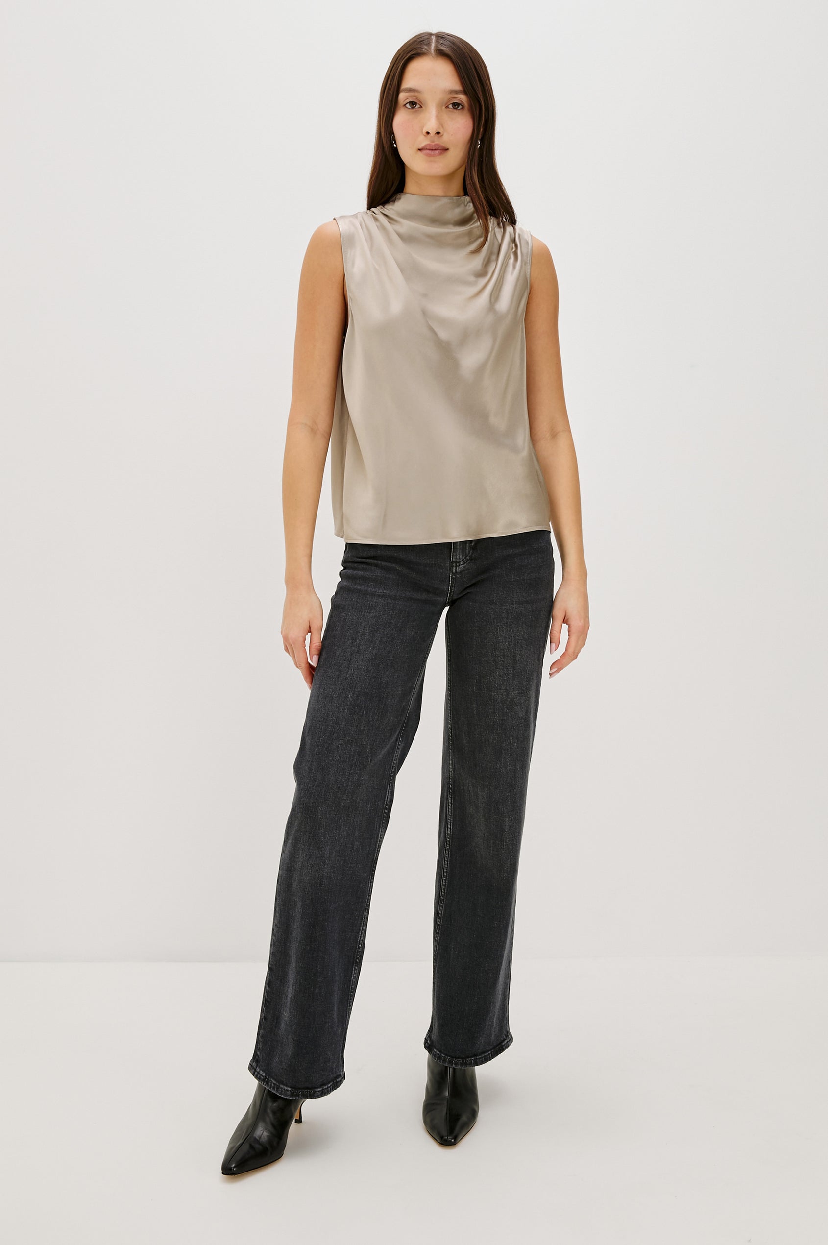 Kaleen Sleeveless Top with Mock Neck with Buttons and Keyhole on the Back and Draped Fabric on the Upper Chest in Mink Colorway - Full Body Front Untucked View Featured on Model