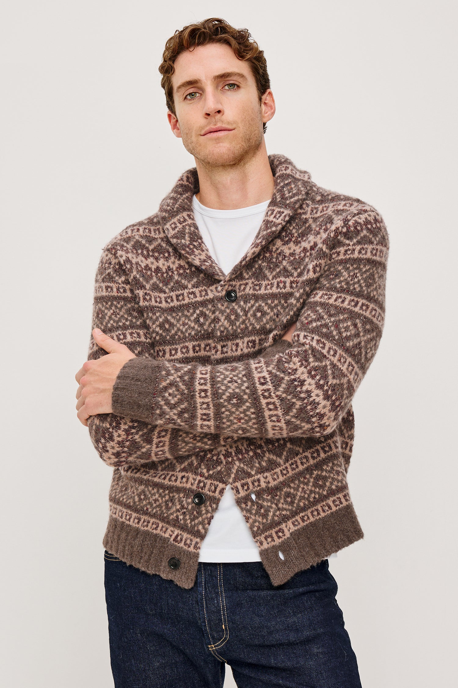 Kallio is a button front cardigan with a lapel in Amiata Farisle. Front view featured on model.