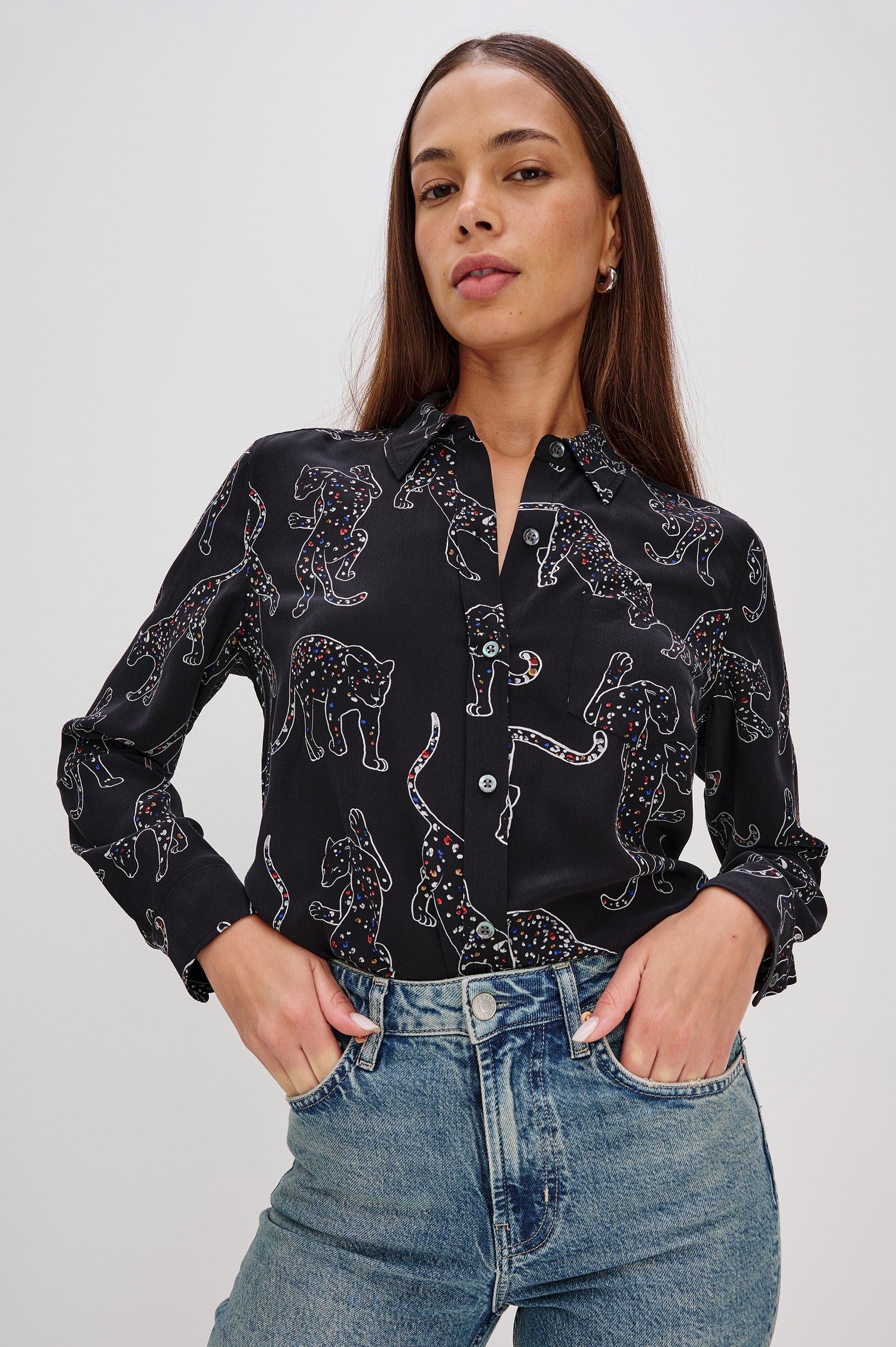 Washed silk button-down shirt in ivory with a horse print. The shirt has a soft drape and classic collar for a polished look. Front View on Model.
