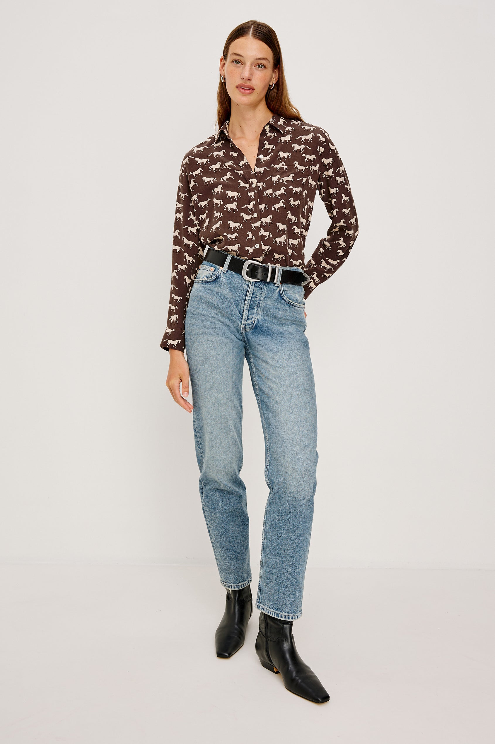 Washed silk button-down shirt in ivory with a horse print. The shirt has a soft drape and classic collar for a polished look. Full Body Front View on Model.