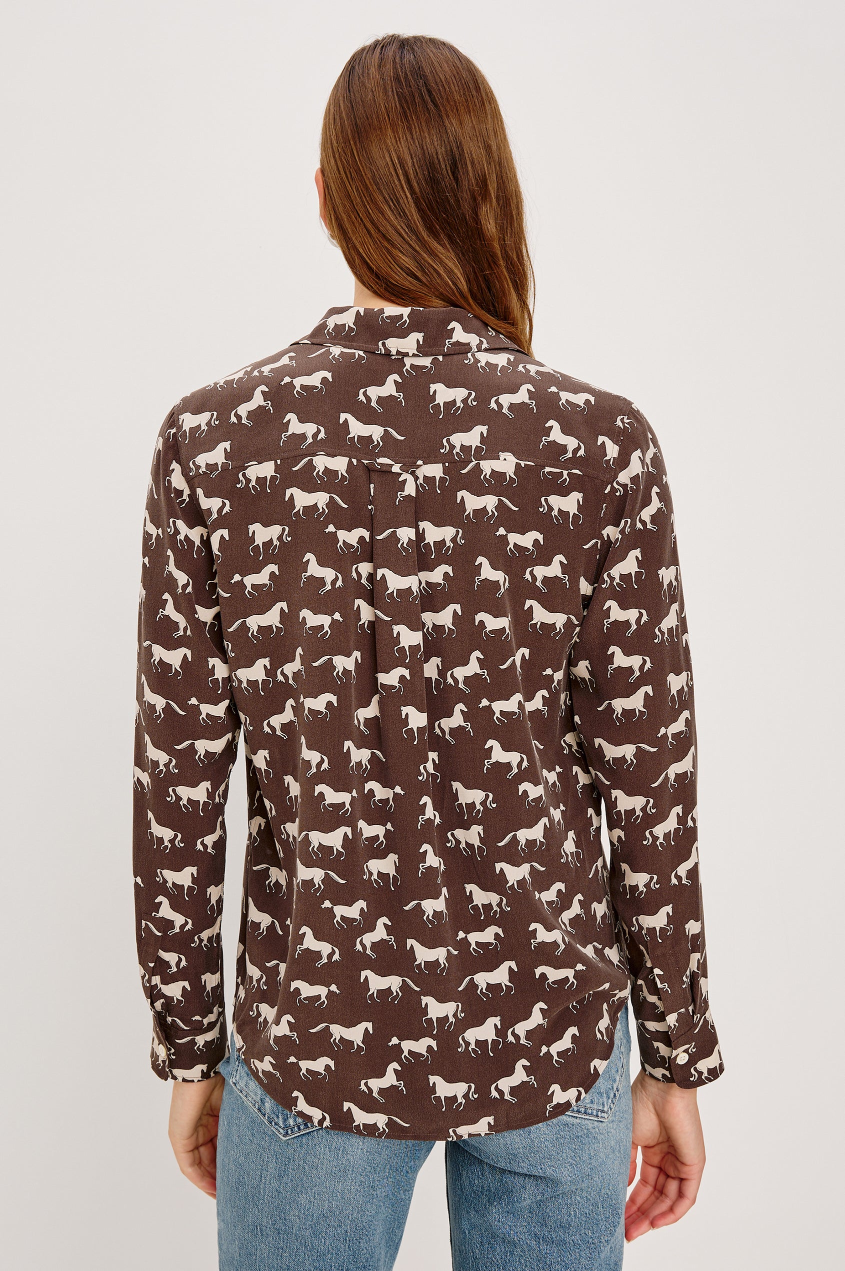 Washed silk button-down shirt in ivory with a horse print. The shirt has a soft drape and classic collar for a polished look. Back View on Model.