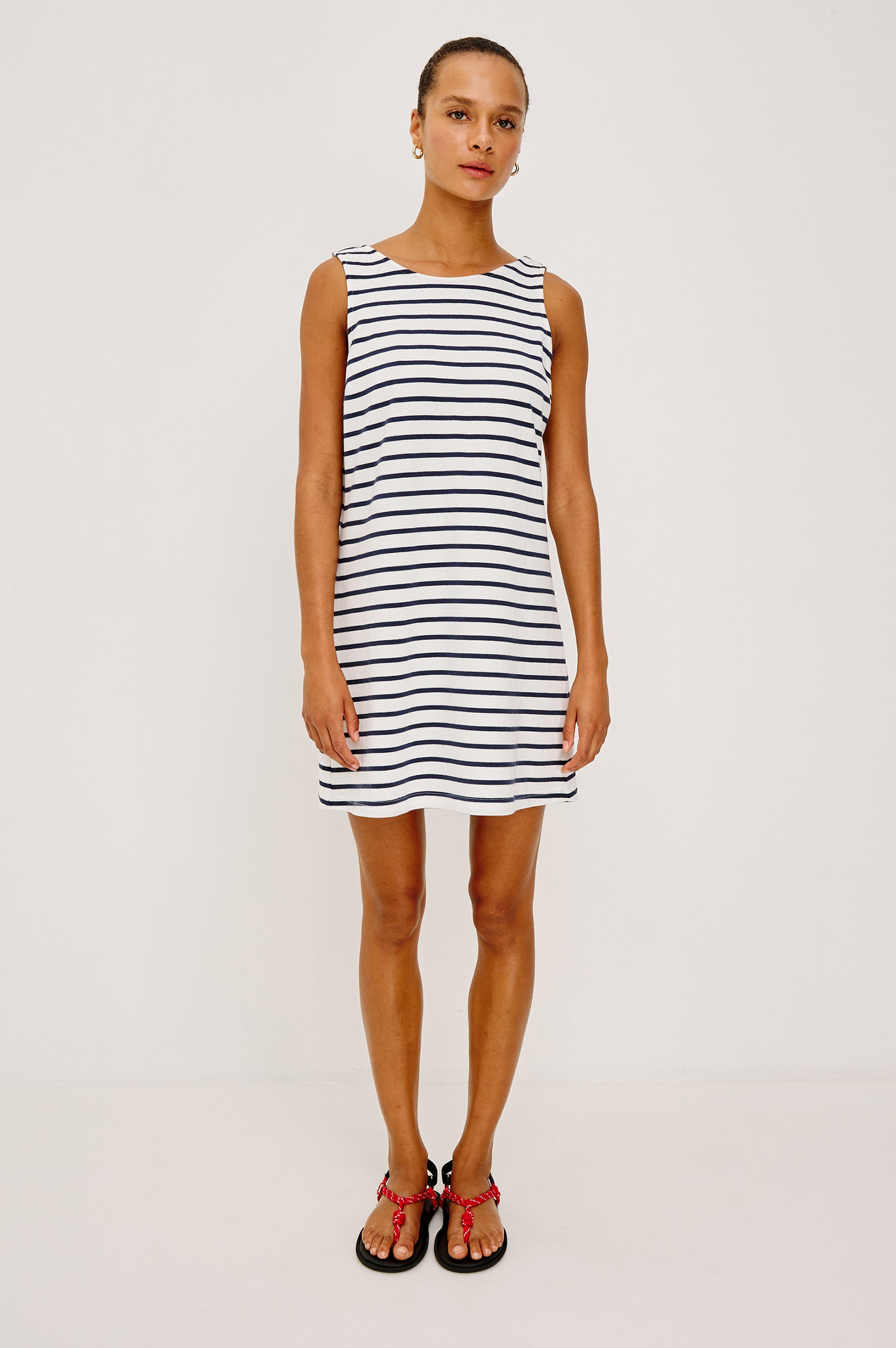 Kaylee Mini Dress in Cotton Jersey With Boat Neckline, A-Line Silhouette, and Scoop Back in Ivory Navy Stripe Colorway - Full Body Front View Featured on Model