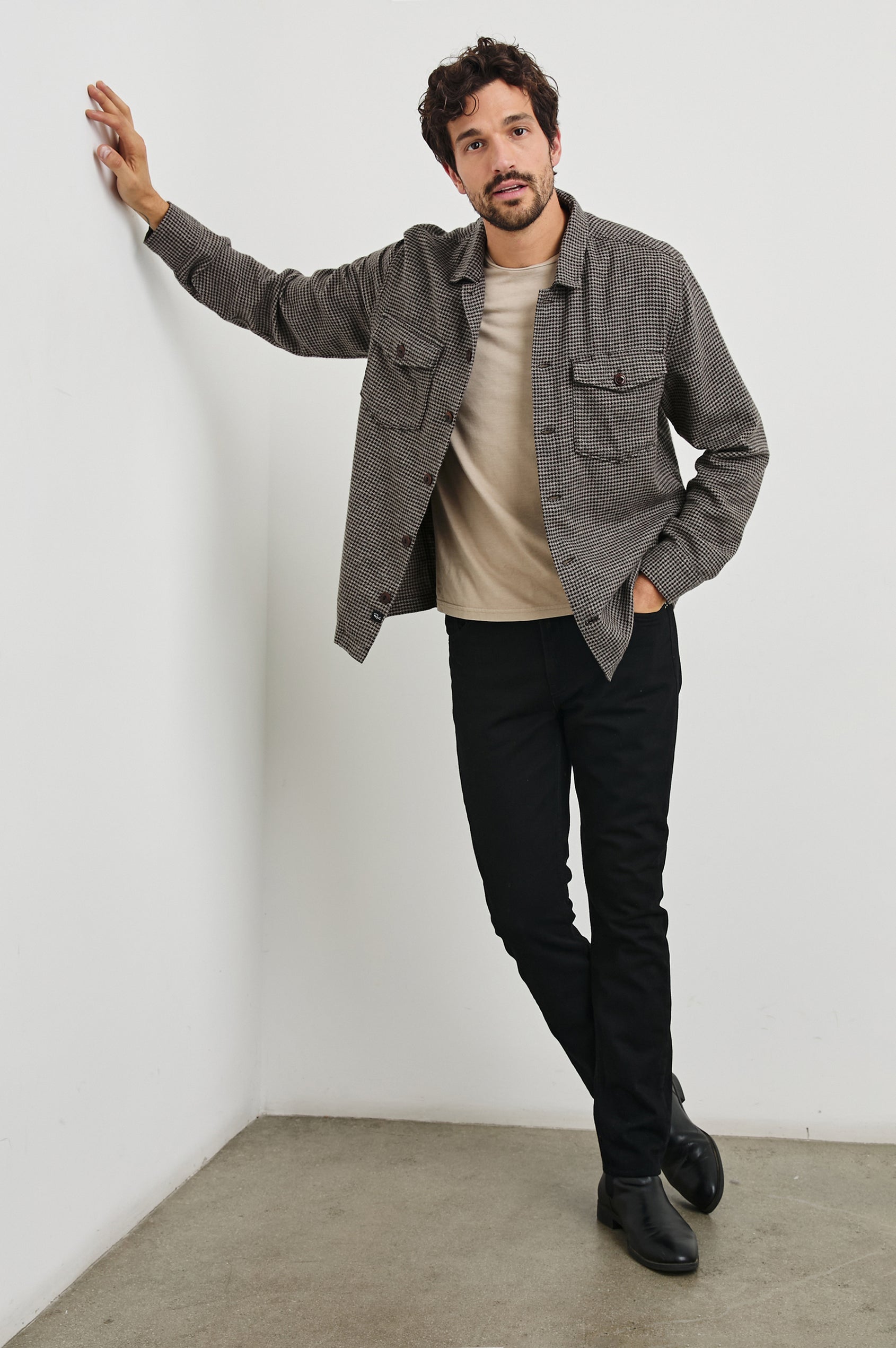 Kerouac Long-Sleeve Shirt Jacket with Button Closure and Two Button Chest Flap Pockets in Mire Colorway, a Tan and Black Houndstooth - Front Full Body View Featured on Model