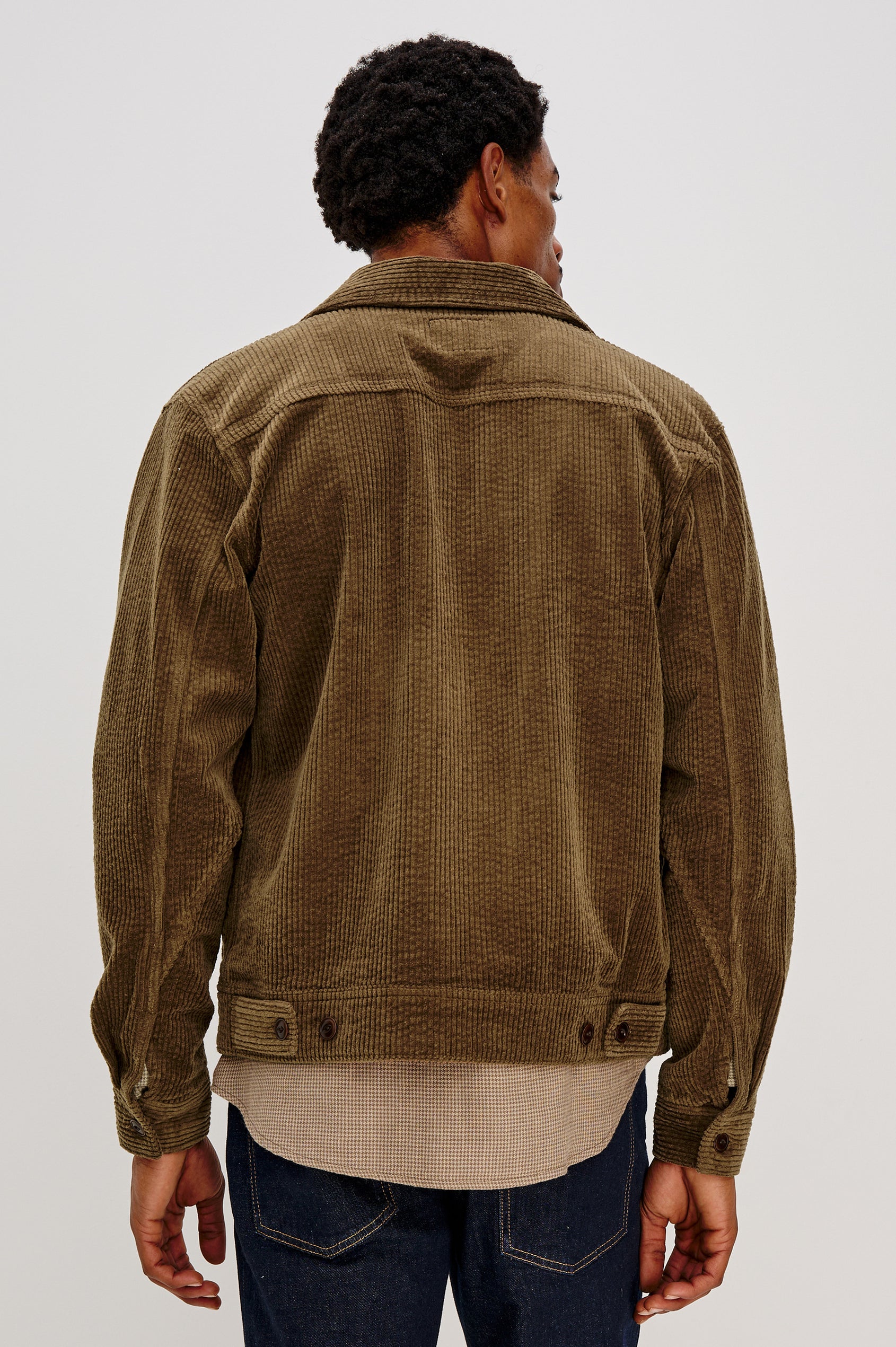 Ketter Zip Up Jacket with Two Curved Front Patch Pockets, a Diagonally Zippered Chest Patch Pocket and Adjustable Button Straps on the Hem in Chicory Colorway, a Warm Brown with Non Contrast Collar - Back View Featured on Model.