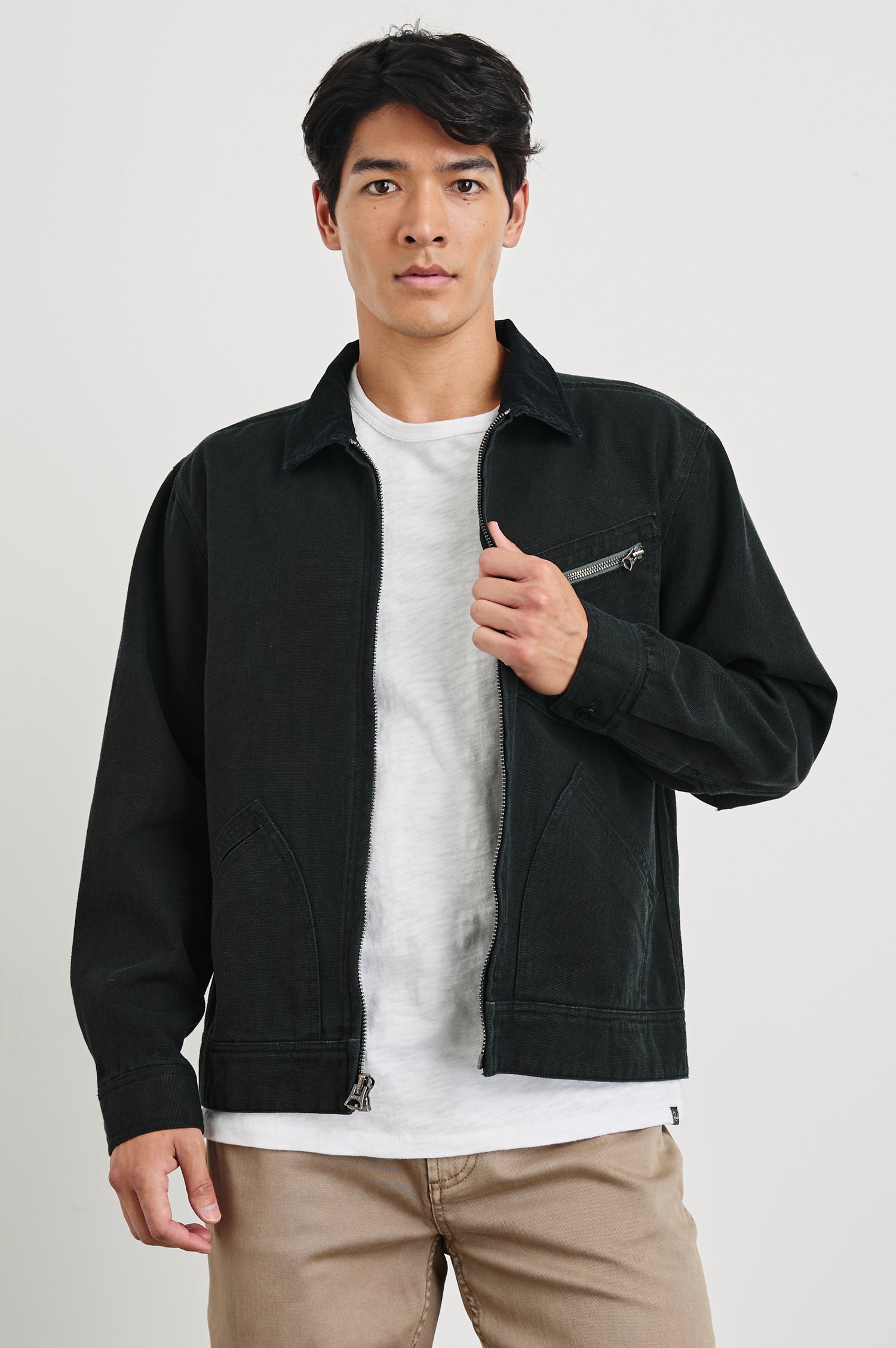 Men's Ketter jacket in raven black with a zip-front closure and durable outdoor construction. Front view of model featured.