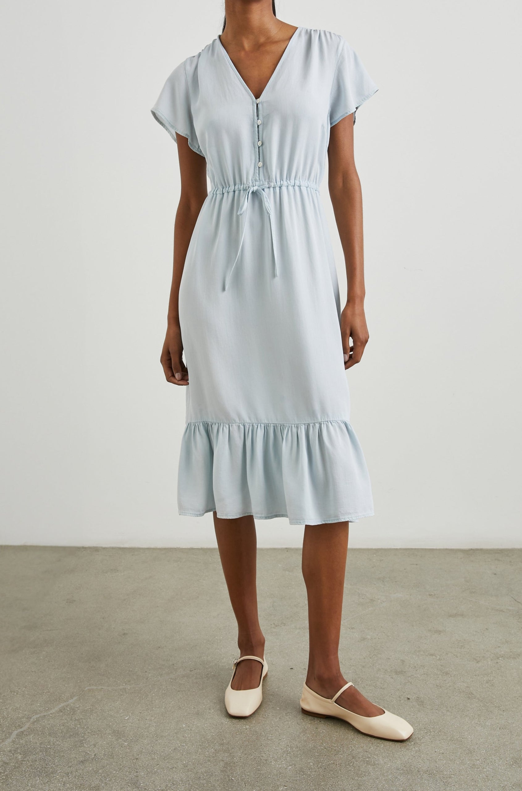 Kiki Short Sleeve Midi Dress with a V Neck, Buttons Down the Front Bodice, a Drawstring Waist and Ruffles at the Hem in Light Vintage Colorway - Front Full Body View Featured on Model 