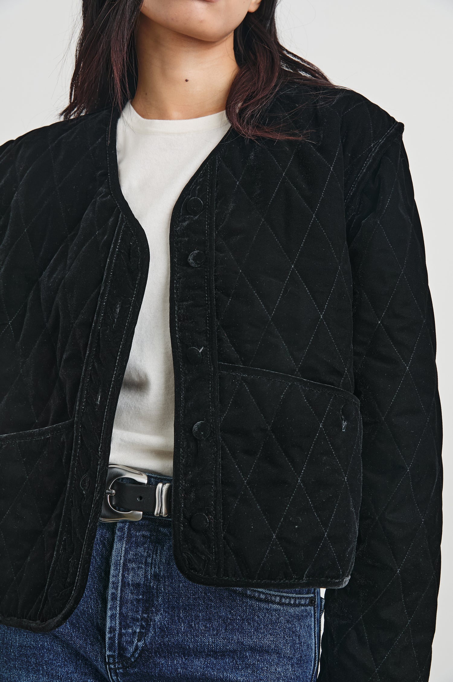 Kiko Jacket with Button Closure, a V Neck, Two Front Patch Pockets and a Quilted Appearance in Black Velvet Colorway - Front View Featured on Model