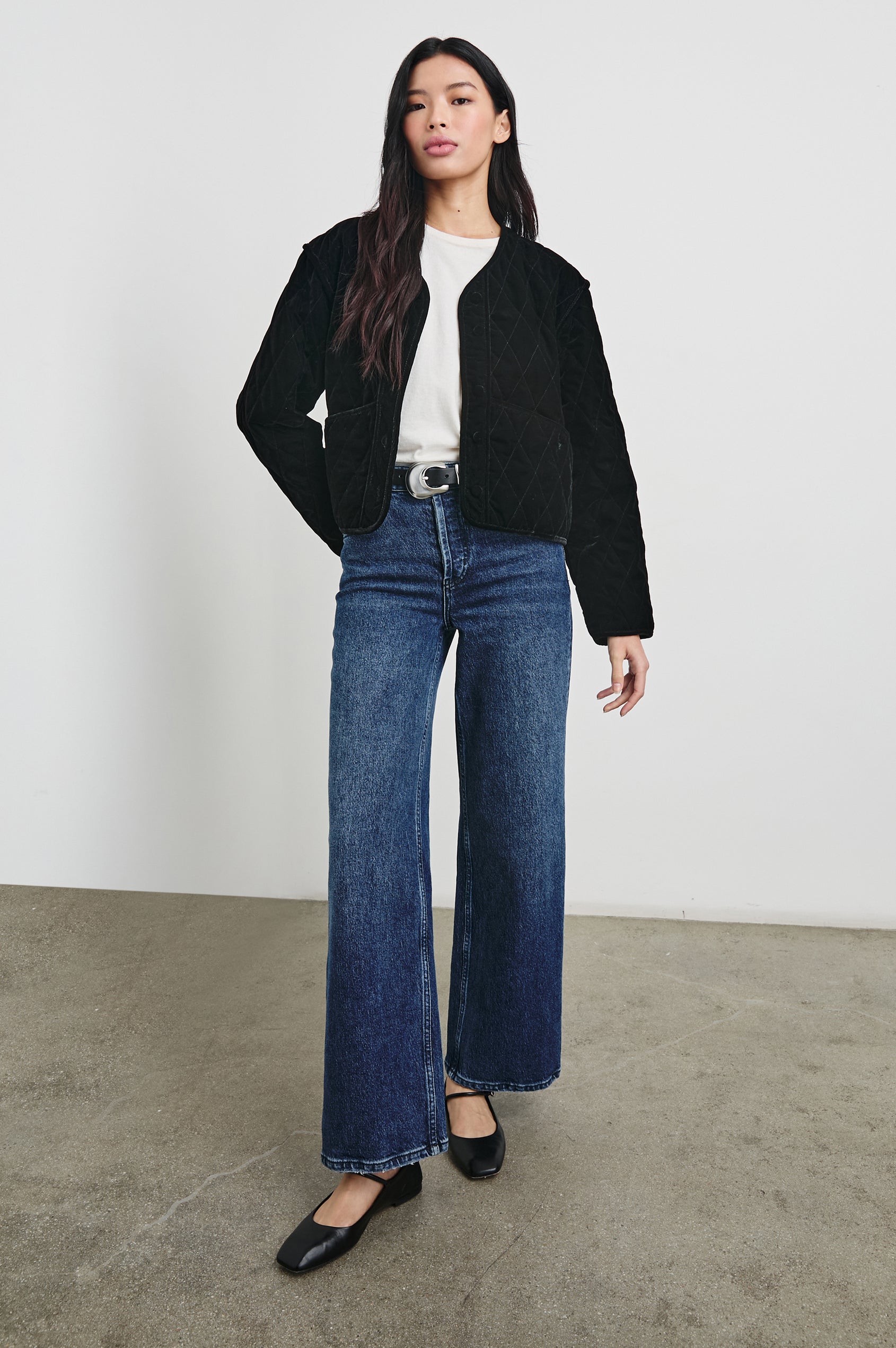 Kiko Jacket with Button Closure, a V Neck, Two Front Patch Pockets and a Quilted Appearance in Black Velvet Colorway - Front Full Body View Featured on Model