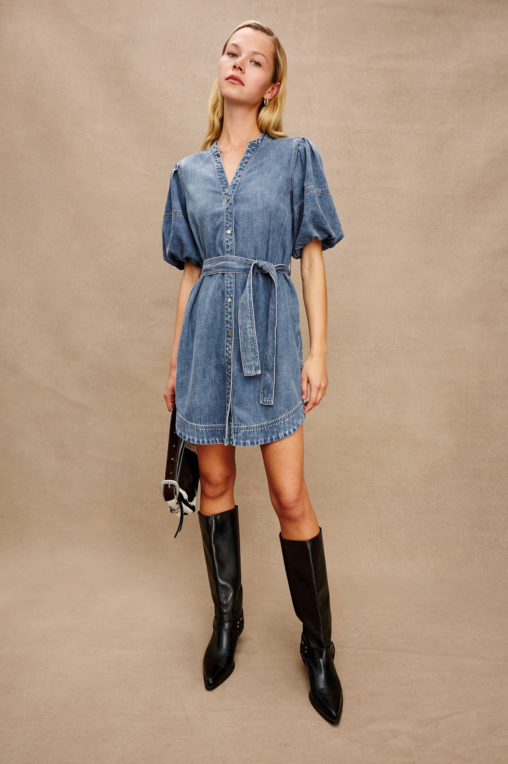Kingsley Denim Mini Dress with Elbow-Length Puff Sleeves, a V Neck, Snaps Down the Front and a Fabric Tie Belt in Antique Blue Colorway - full body front view on model
