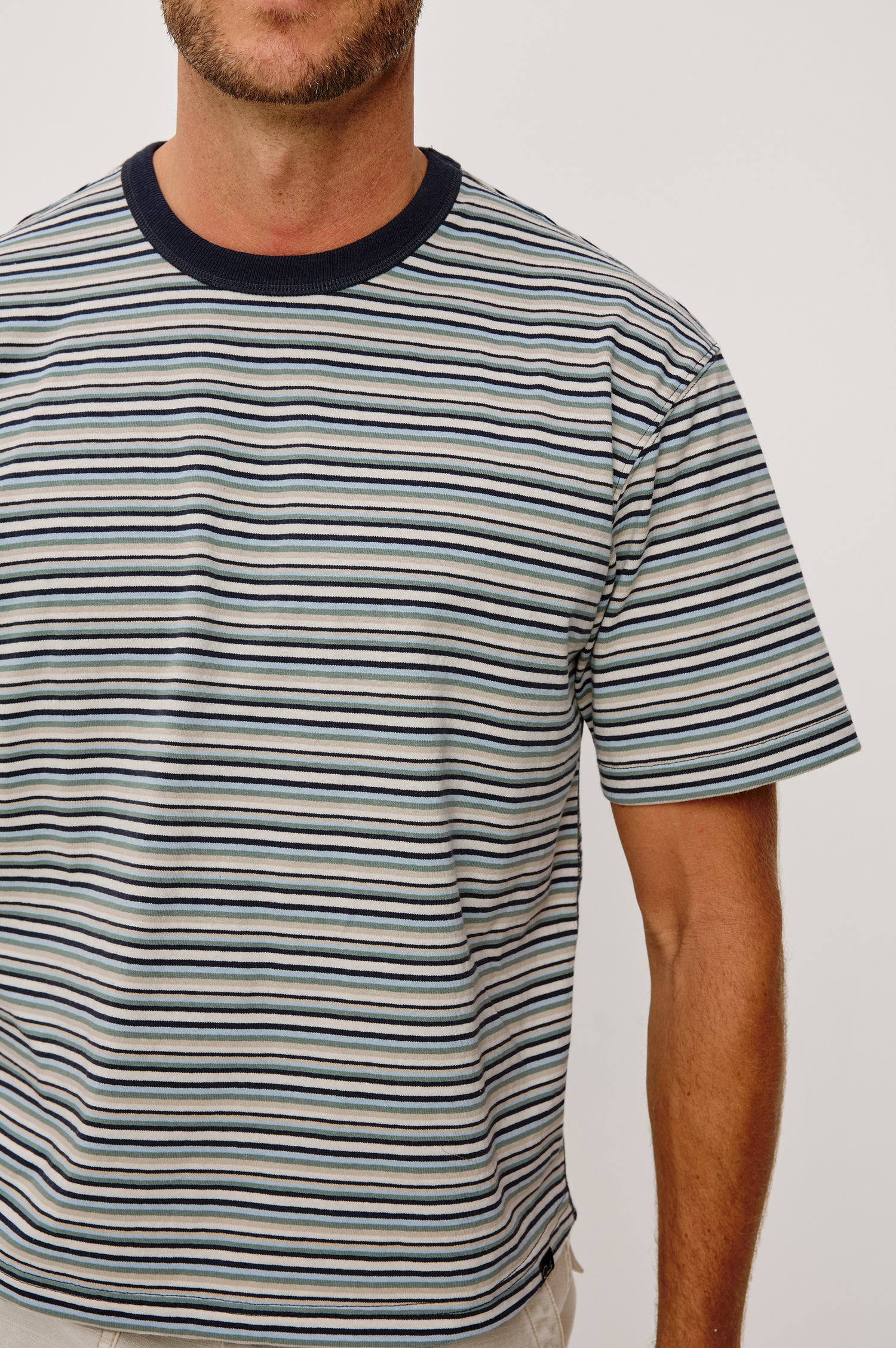 Kip T-Shirt in Relaxed Boxy Fit in Yarn-Dyed Jersey, Contrast Crew Neckline, and Short Sleeves in Azul Stripe Colorway - Upper Body Close Up Front View Featured on Model