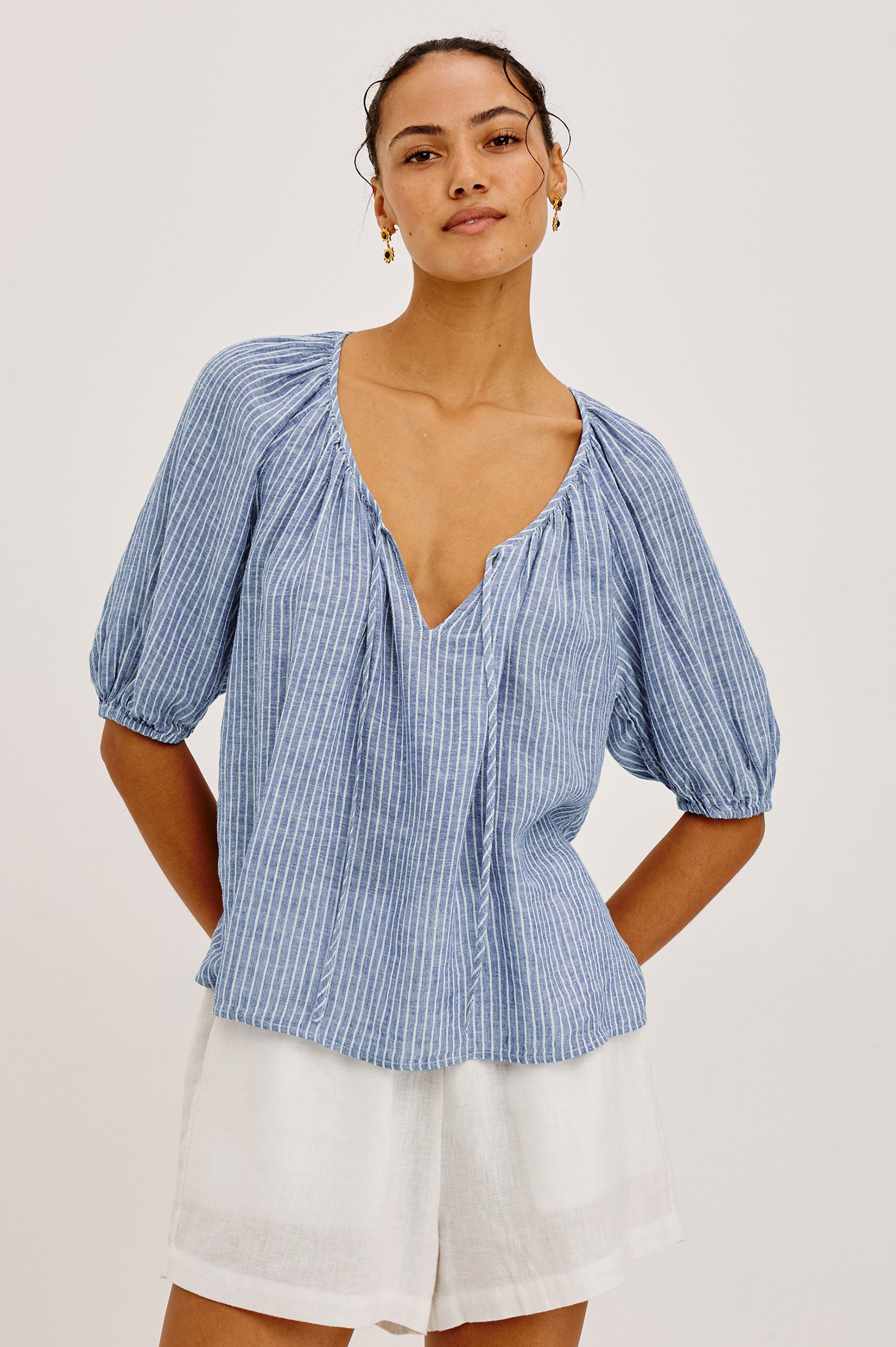 Kirstie Linen Top With Wide Scoop Neckline and Self-Ties, Elbow-Length Raglan Sleeves With Elastic Cuffs, and Loose Fit in Barletta Stripe Colorway - Upper Body Front View Featured on Model