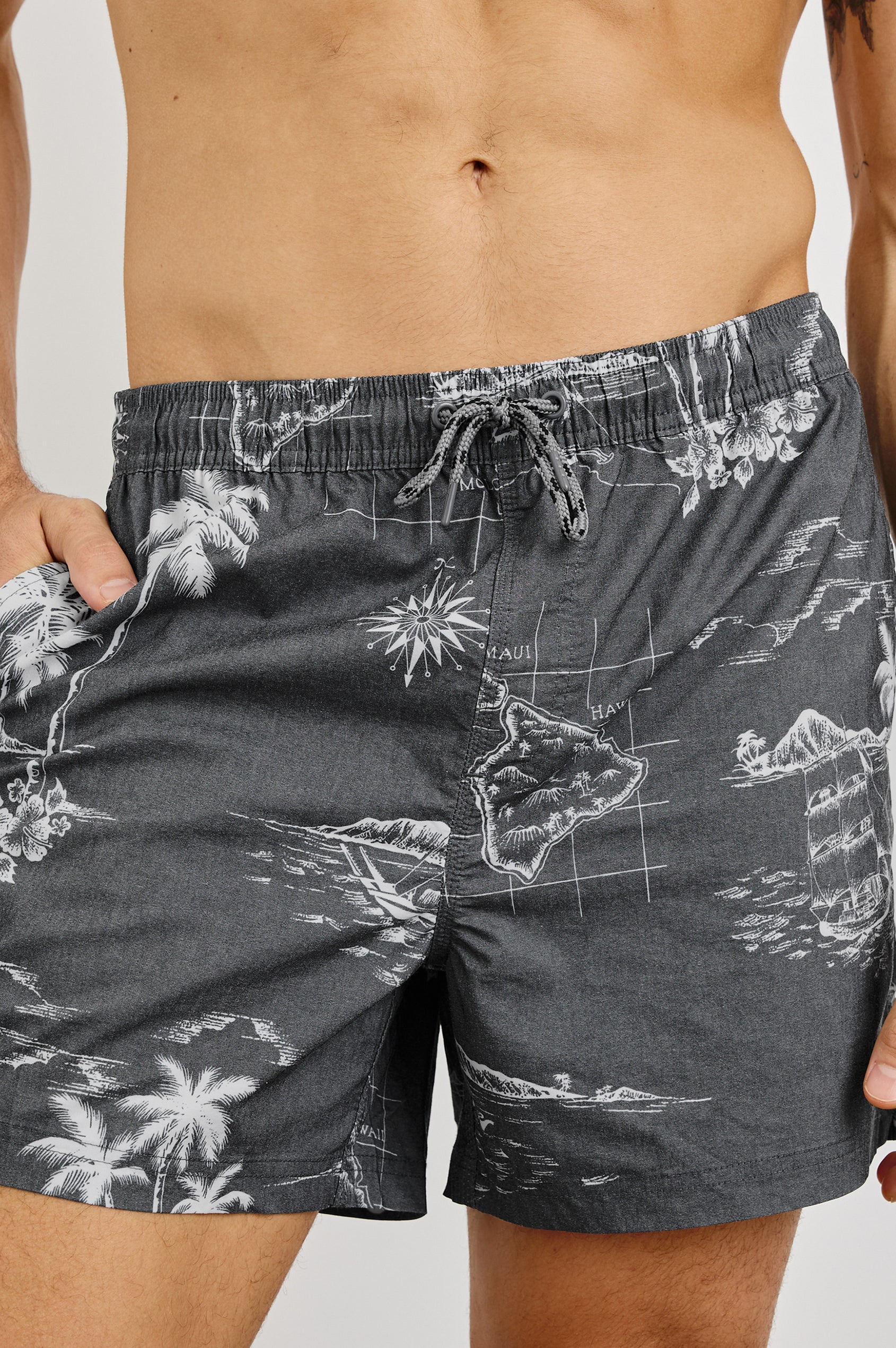 La Brea Swim Short with a Drawstring Waistband and Side Pockets in Paradise Washed Black Colorway. Front View Shown on Model.