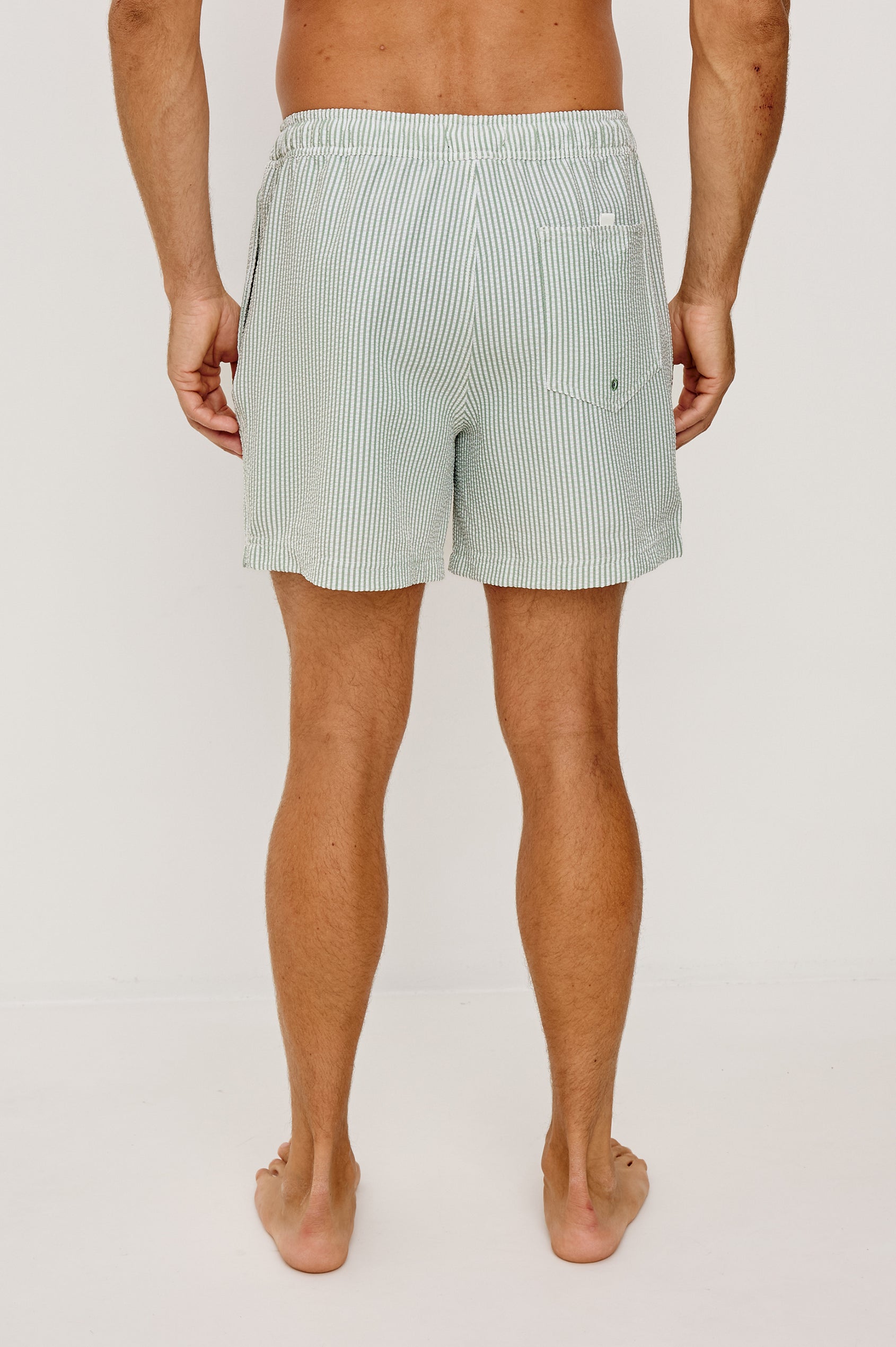 The Amalfi Button-Up Short Sleeve Shirt in Lightweight Stretch Linen-Blend With a Notched Collar and Classic Fit in Sage White Seersucker - Lower Body Back View Featured on Model