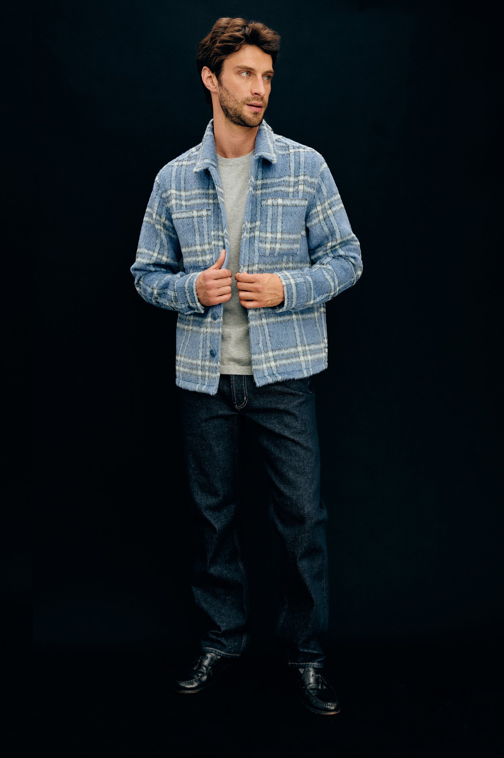 Lachlan is a fully lined shirt jacket with a classic collar, front buttons, chest patch pockets in Blue Lotus colorway. Front full body view featured on model.