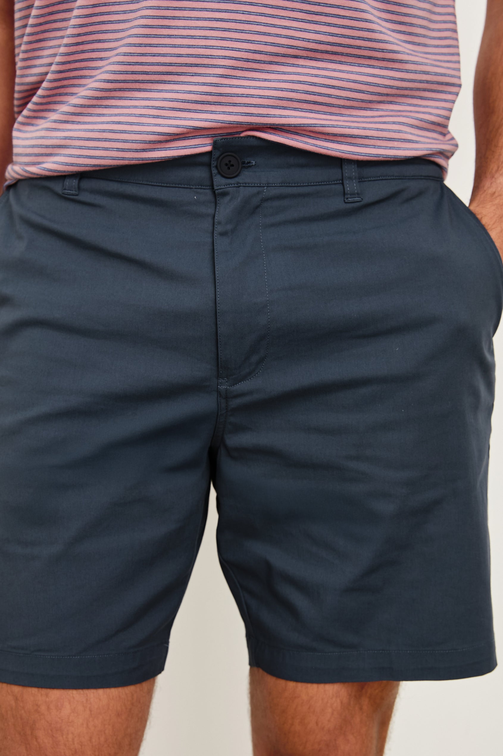 Laguna cotton lid-length short with front button closure and belt loops - close up of details on model