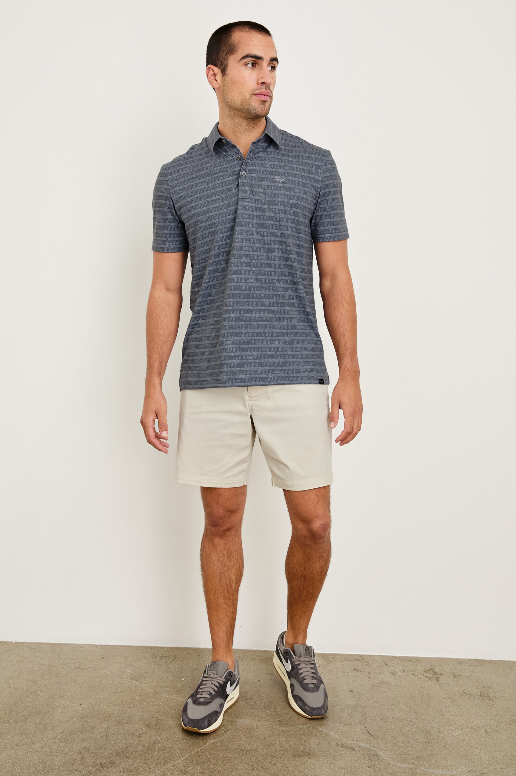 Laguna cotton lid-length short with front button closure and belt loops - full body front view on model