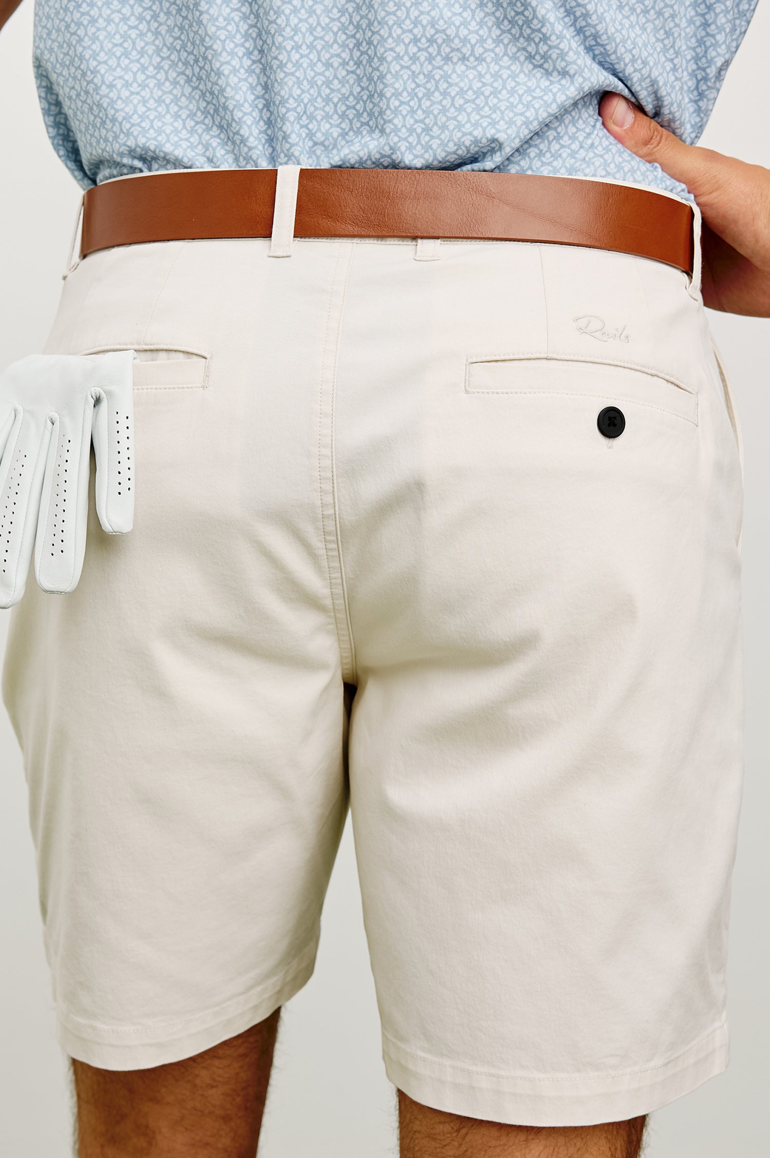 Laguna Mid-Length Short in Light Stretch Cotton With Belt Loops and Side Zip Pockets in Stone Colorway - Lower Body Back View Featured on Model