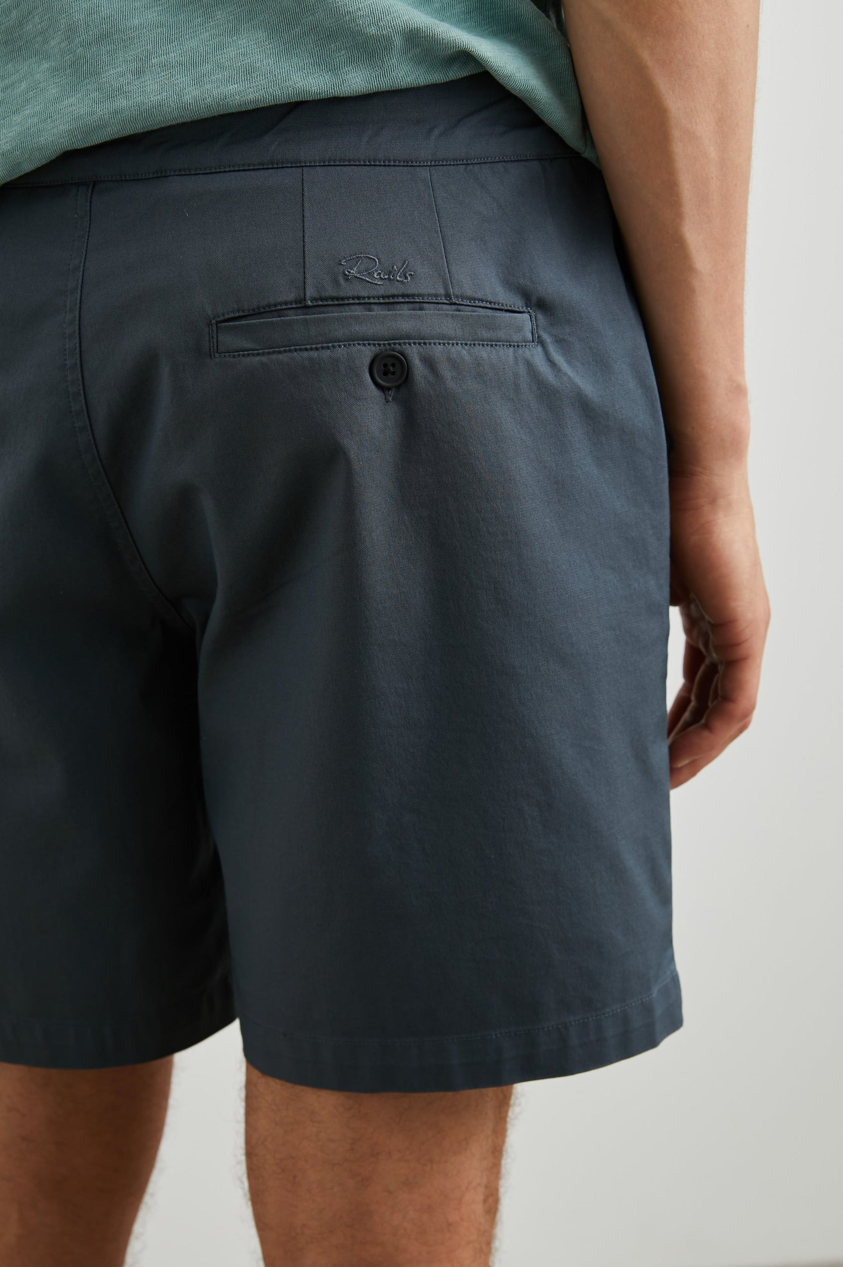 Laguna cotton lid-length short with front button closure - close up of back details on model