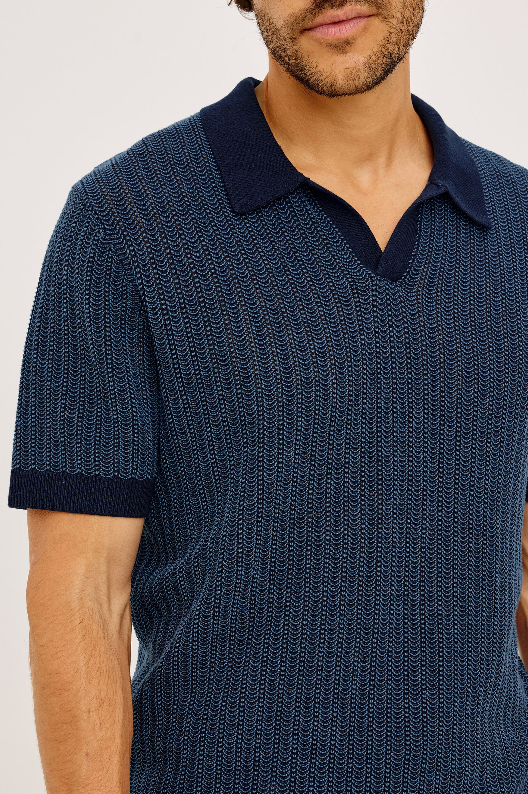 Langley Polo Shirt in Lightweight Contrast Open Birdseye Knit With Classic Fit, Open Collar, Short Sleeves, and Ribbed Trim in Navy Marine Ripple Colorway - Upper Body Front View Featured on Model