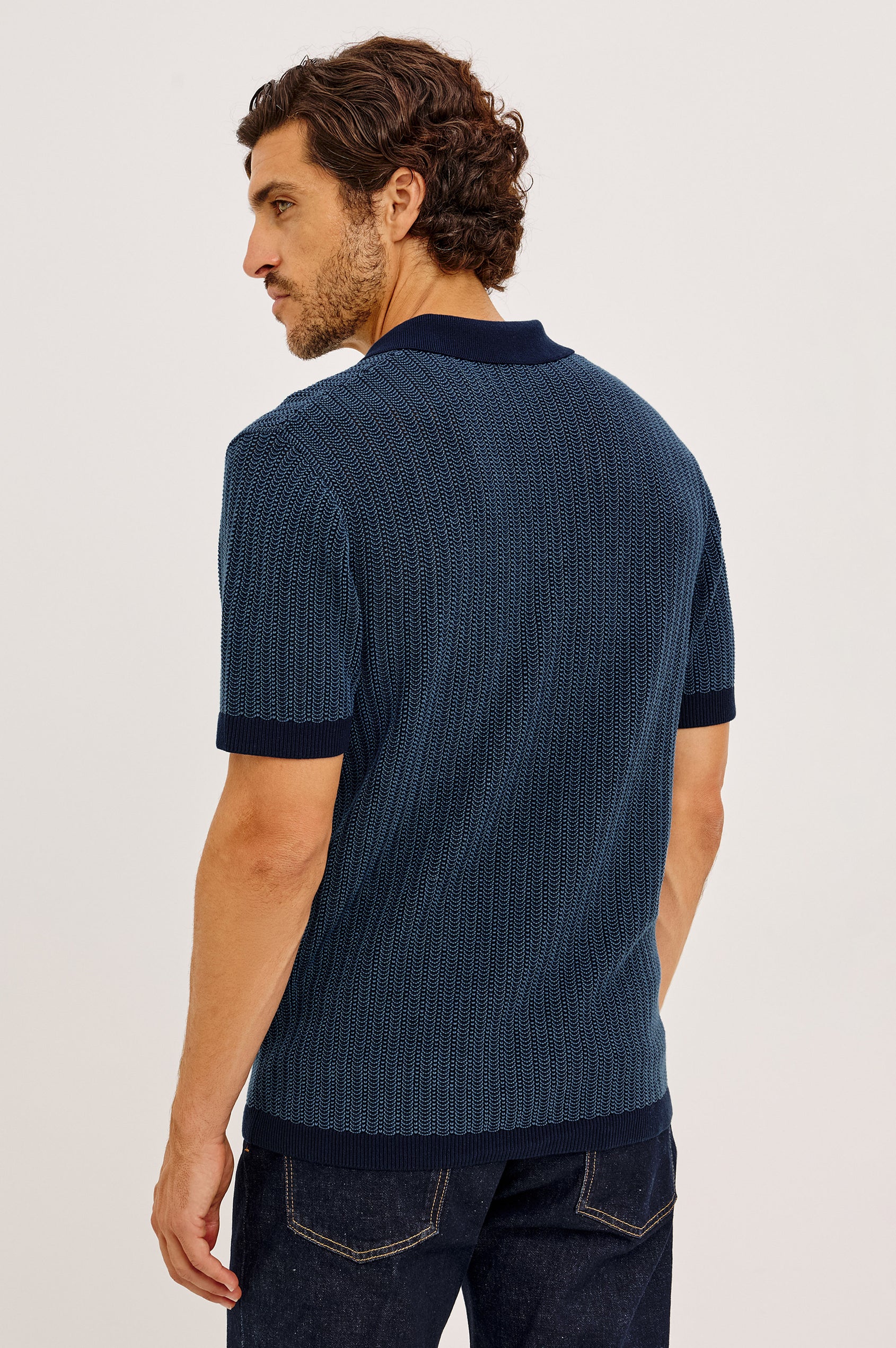 Langley Polo Shirt in Lightweight Contrast Open Birdseye Knit With Classic Fit, Open Collar, Short Sleeves, and Ribbed Trim in Navy Marine Ripple Colorway - Upper Body Back View Featured on Model