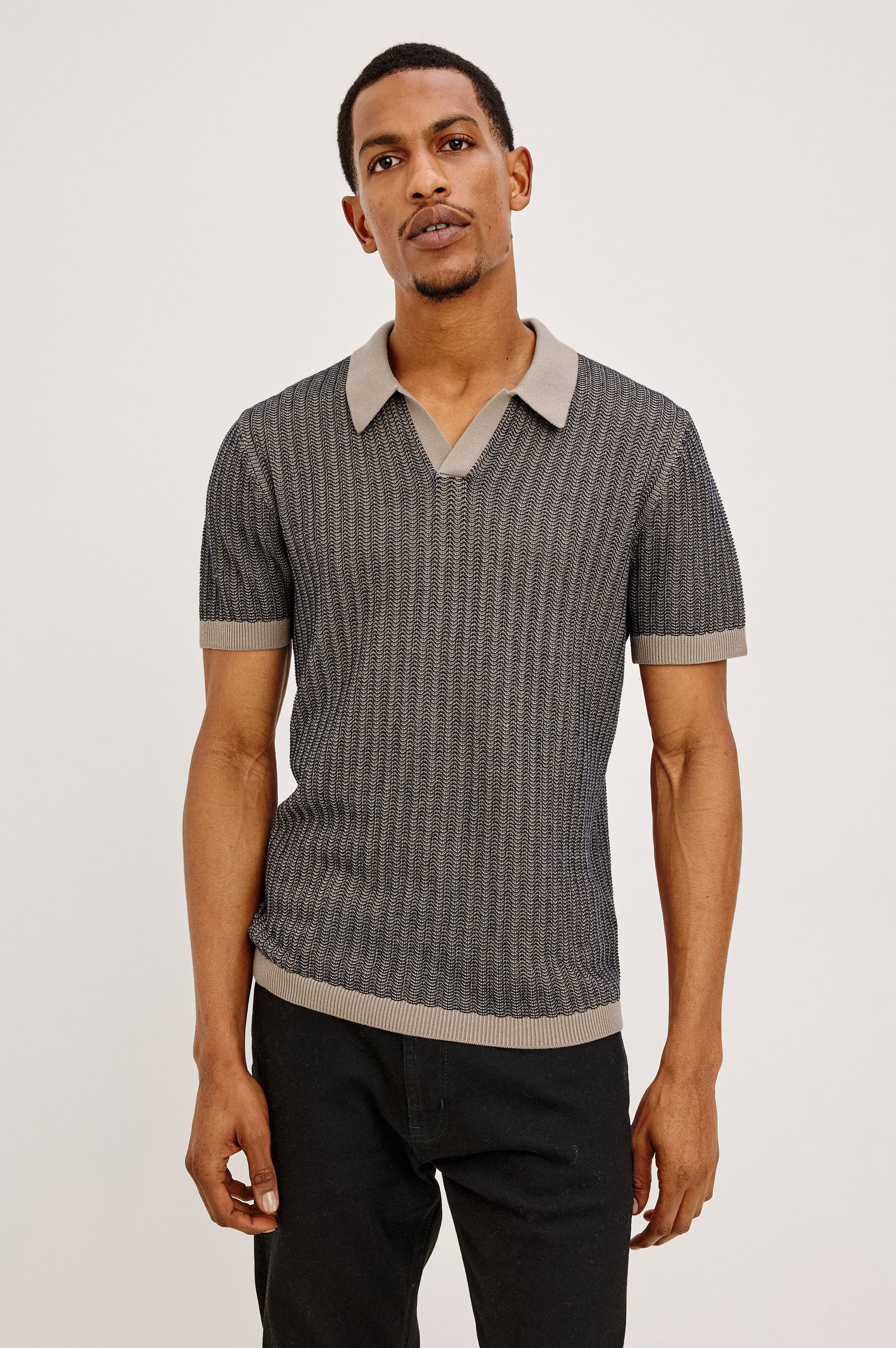 Langley Polo Shirt in Lightweight Contrast Open Birdseye Knit With Classic Fit, Open Collar, Short Sleeves, and Ribbed Trim in Oat Midnight Ripple Colorway - Upper Body Front View Featured on Model