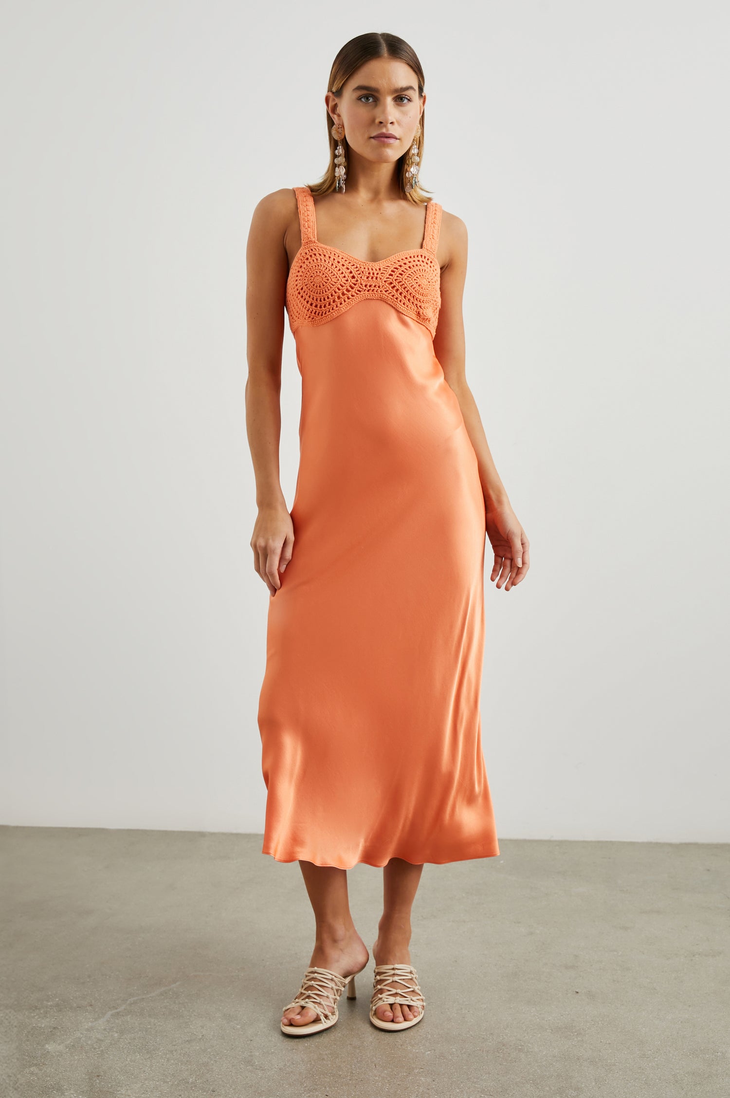 Laura Sleeveless Midi Dress with a Sweetheart Neckline and Crochet on the Bodice and Shoulder Straps in Papaya Colorway - Front Full Body View Featured on Model 